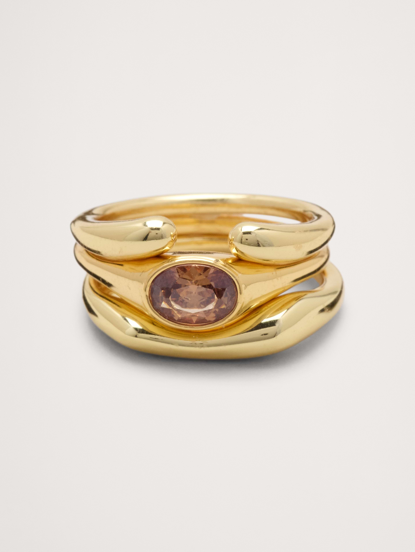 Image 1 of 3, Why stop at one? Layered bands create the look of multiple rings, fused into a chunky, fluid metal shape wrapped around a center gemstone., Product #1193060