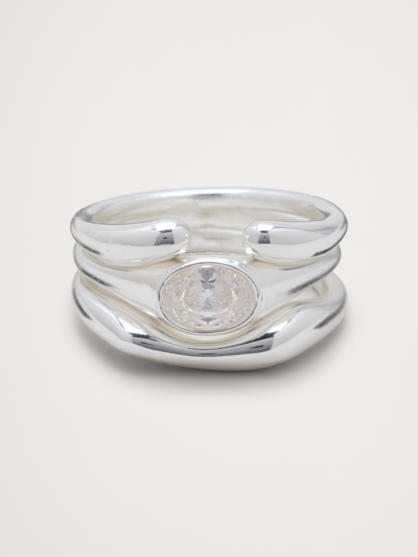 Image 1 of 3, Why stop at one? Layered bands create the look of multiple rings, fused into a chunky, fluid metal shape wrapped around a center gemstone., Product #1193060