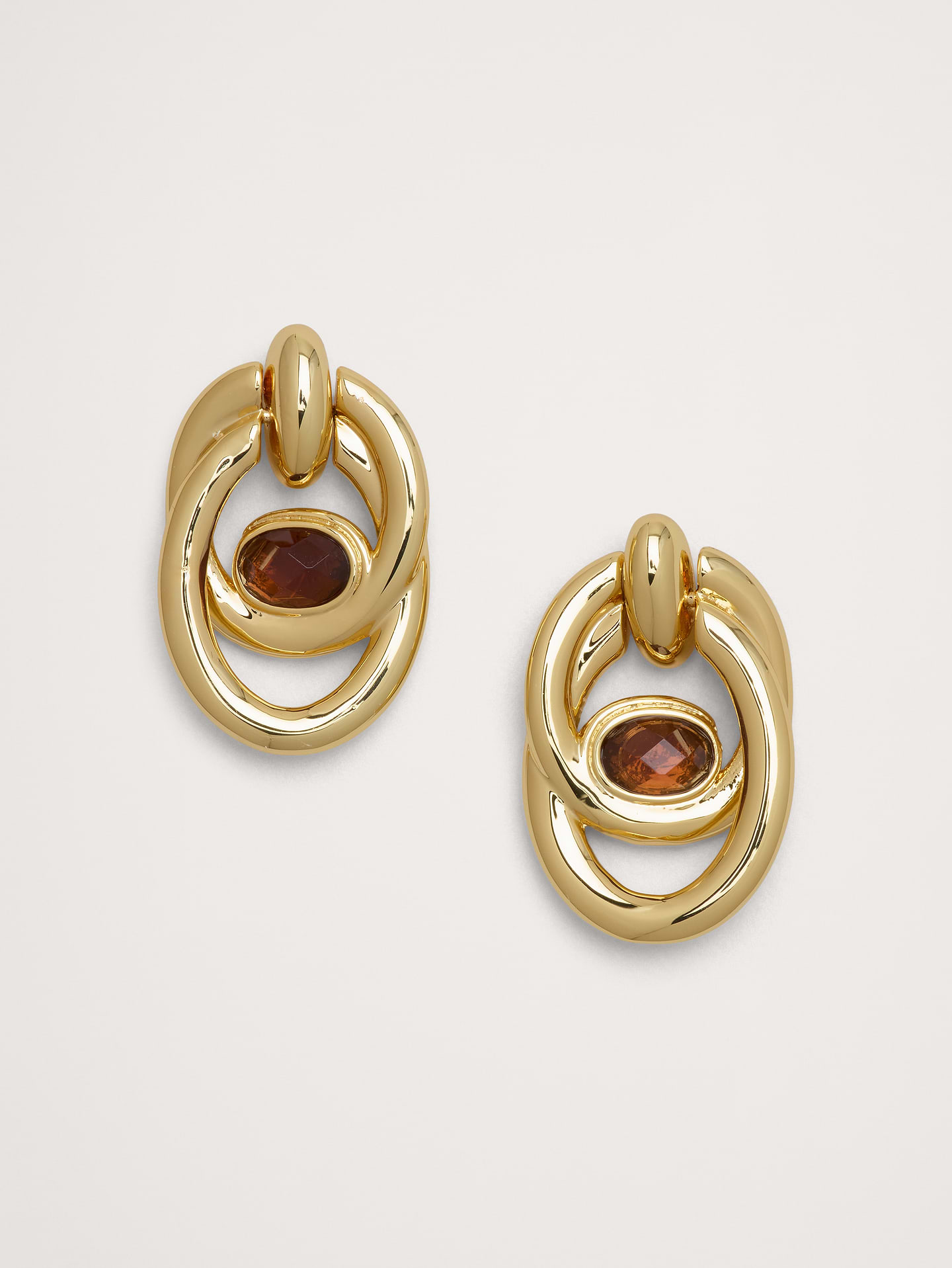 Image 1 of 2, We reimagined the vintage door-knocker silhouette with a chunky, interlocking double-hoop design and oval center stone., Post backs., Product #1193066