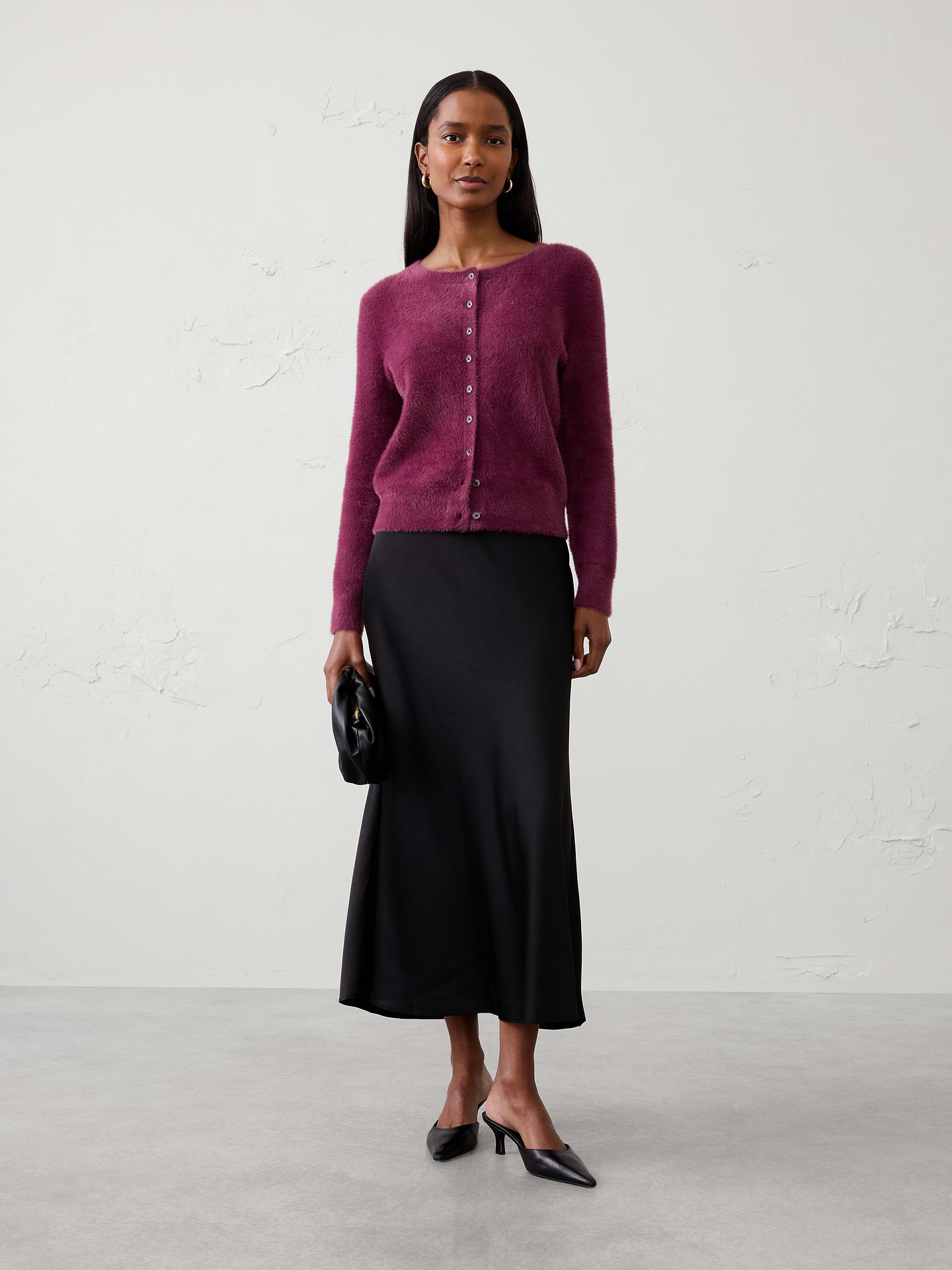 Image 1 of 4, Crafted from our signature eyelash yarn, this cardigan delivers an ultra‑soft, plush feel with a luxurious hand. The fuzzy texture adds rich dimension and cozy warmth, making it an effortless layering piece for cooler days., Crew neck. Long sleeves., Button‑front closure., Care suggestion: Use a low‑heat iron; steam as needed., Made exclusively for Banana Republic Factory., Product #1177061