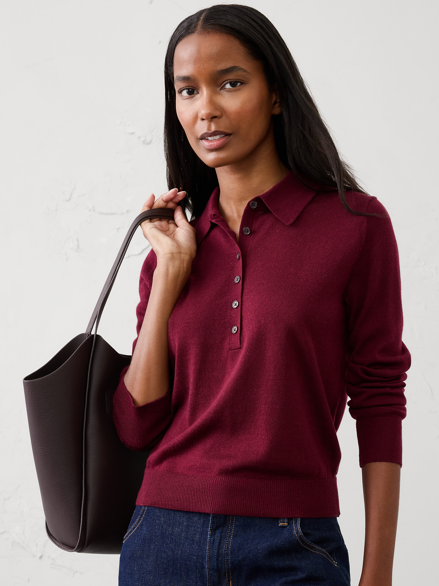 Image 1 of 1, Crafted from luxuriously soft Merino wool, this sweater offers lightweight warmth and natural breathability for all‑day comfort. Perfect for layering or wearing on its own, it delivers timeless versatility with an effortlessly refined finish., Polo collar. Long sleeves., Button placket., Ribbed arm cuffs and hem., Made exclusively for Banana Republic Factory., Product #1177059