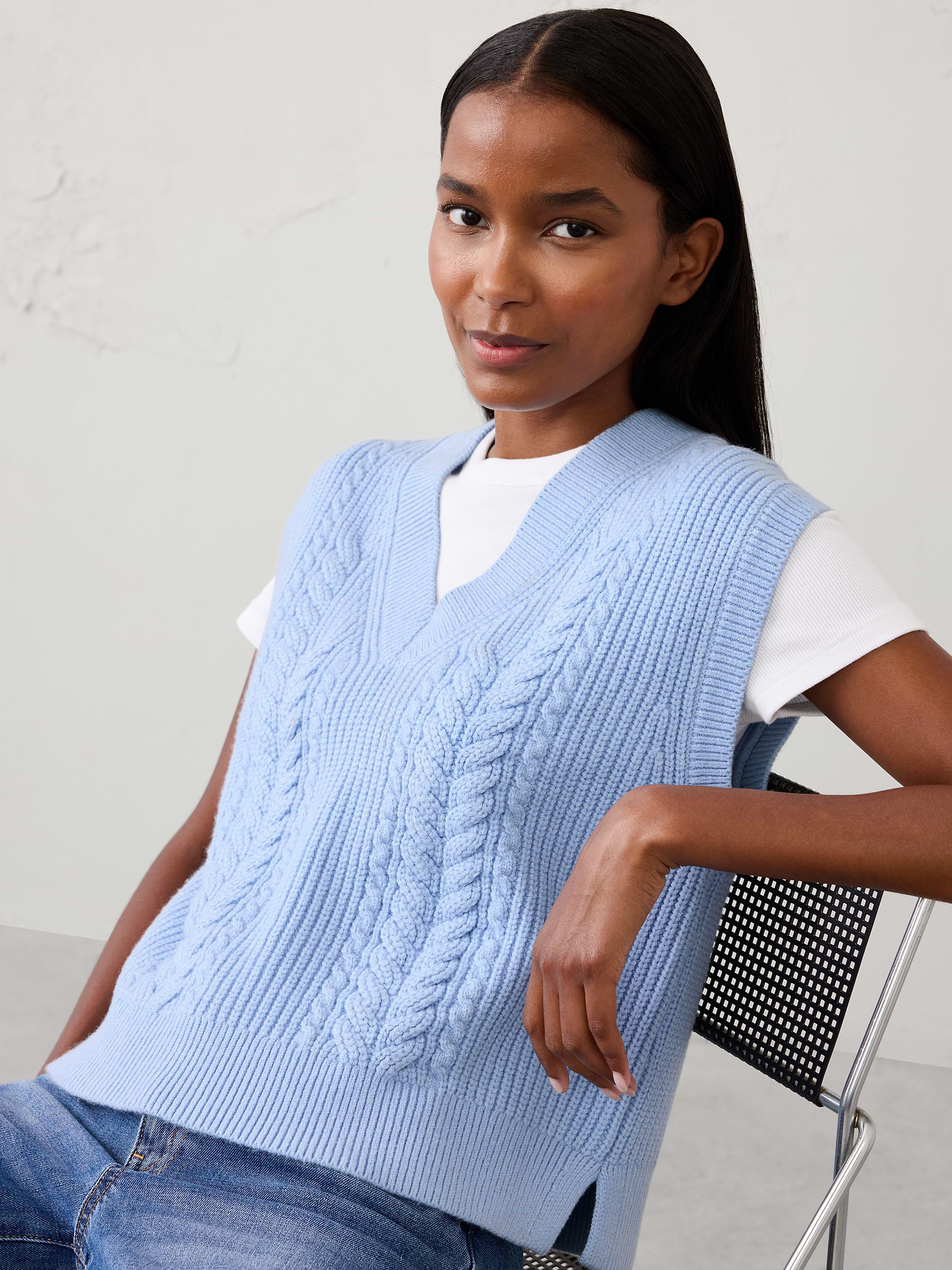 Image 1 of 4, Our sweater is knit from our signature Perfectly Soft yarn—a luxurious blend of cotton with a hint of wool, that feels as cozy as it looks. Classic cable stitching adds timeless texture and dimension, elevating the clean silhouette with a heritage‑inspired touch., V-neckline. Cap sleeves., Ribbed neck, arm cuffs and hem., Made exclusively for Banana Republic Factory., Product #1177098