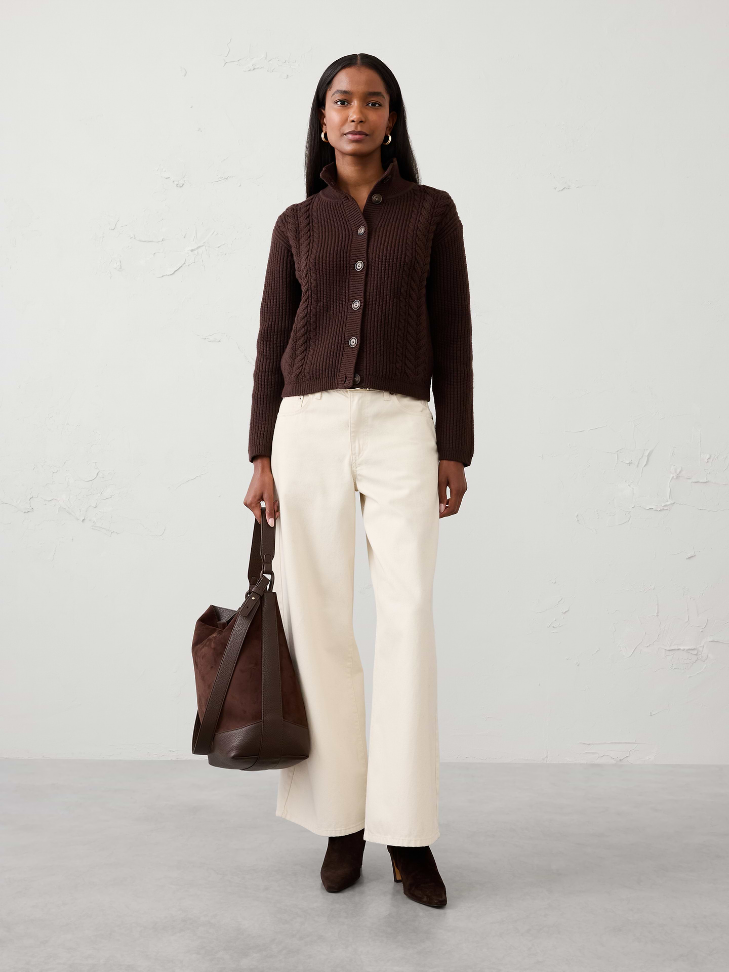 Image 1 of 4, Our sweater is knit from our signature Perfectly Soft yarn—a luxurious blend of cotton with a hint of wool, that feels as cozy as it looks. Classic cable stitching adds timeless texture and dimension, making it an easy layer for workdays, weekends, and everything in between., Mock neck. Long sleeves., Drop shoulders., Button‑front closure., Made exclusively for Banana Republic Factory., Product #1177081
