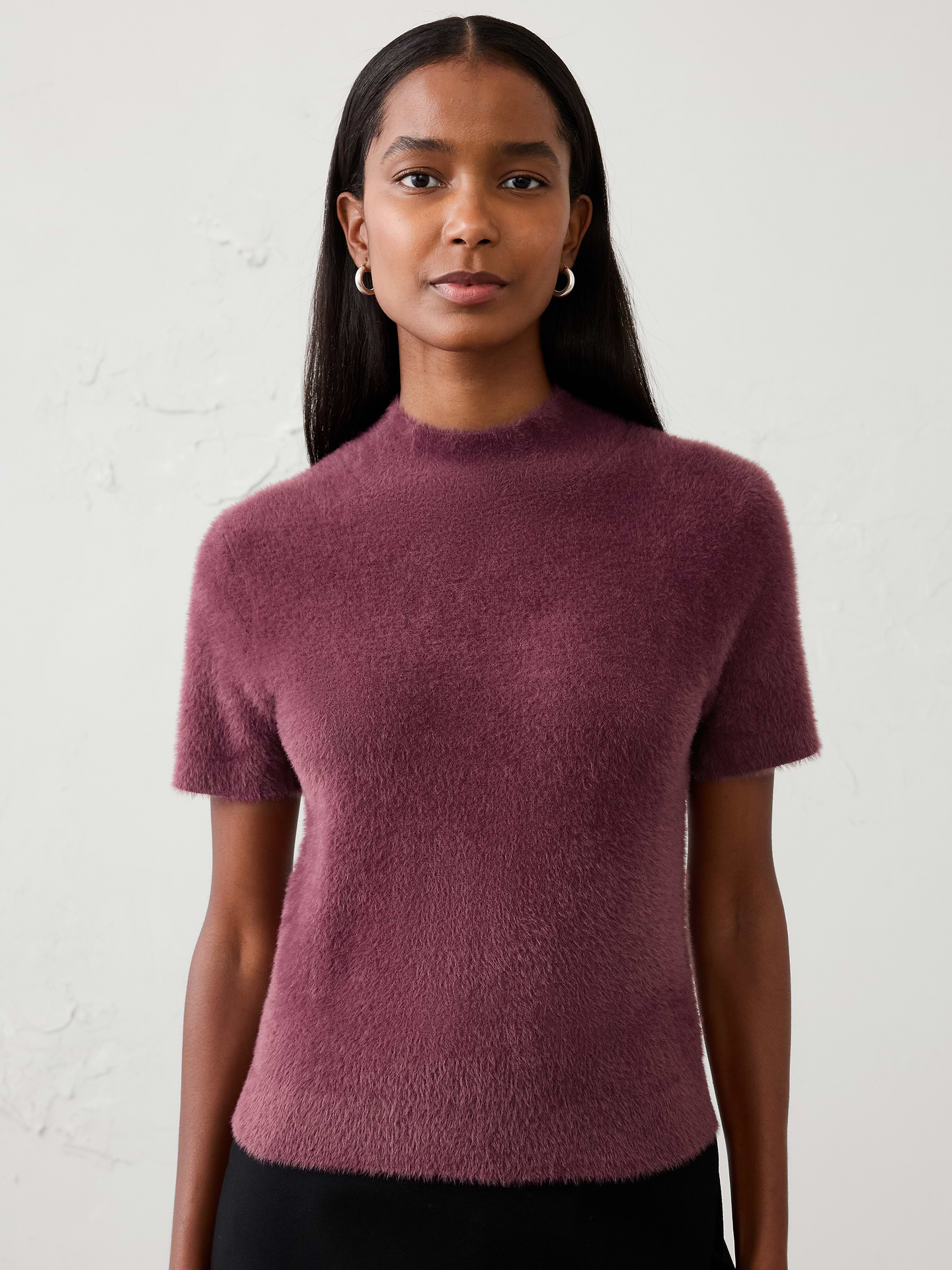 Image 1 of 4, Crafted from our signature eyelash yarn, this mockneck sweater delivers a plush, luxurious feel with rich texture and cozy warmth. The elevated mockneck silhouette adds a refined touch, while the soft, fuzzy finish makes it a standout piece for cooler weather., Mock neck. Short sleeves., Ribbed neck, arm cuffs and hem., Care suggestion: Use a low‑heat iron; steam as needed., Made exclusively for Banana Republic Factory., Product #1177067