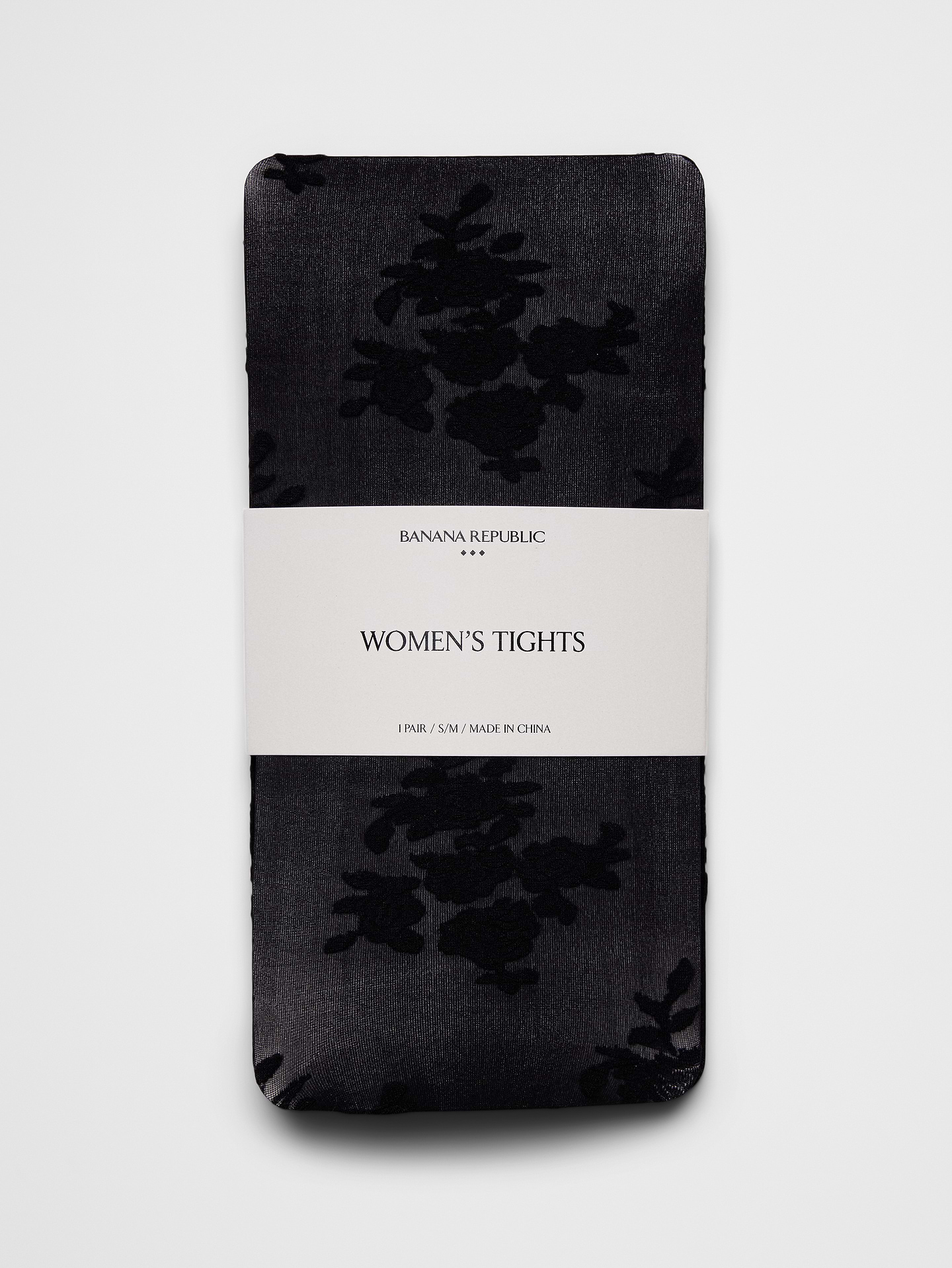 Image 1 of 4, Make a statement with these patterned tights, designed with an intricate floral lace motif woven into a sheer fishnet construction. The delicate pattern adds texture, dimension, and a feminine touch, making them an easy way to elevate dresses, skirts, and occasion looks., Made exclusively for Banana Republic Factory., Product #1180939