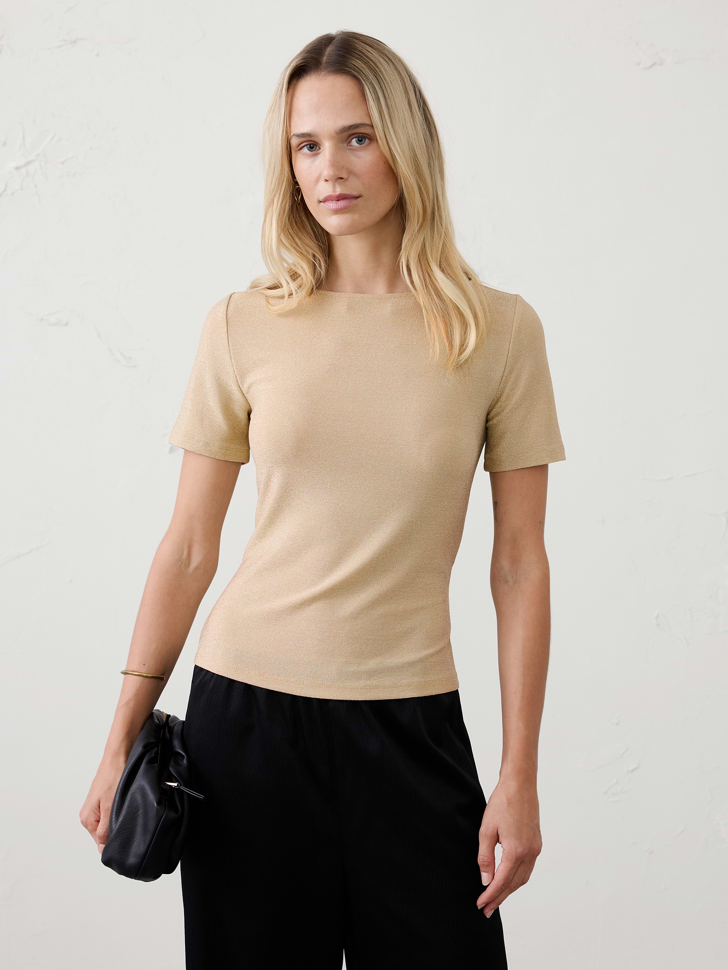 Image 1 of 4, This sparkle knit top pairs a graceful boat neckline with a soft, comfortable feel that's completely itch‑free. Equal parts polished and easy to wear, it adds just the right amount of shine to holiday celebrations, evenings out, and special occasions., Boatneck. Short sleeves., Fitted at the waist., Made exclusively for Banana Republic Factory., Product #1186024