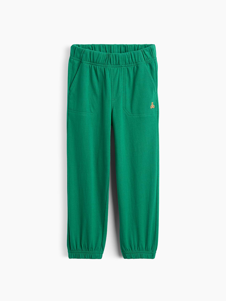 Image 1 of 2, Ours, yours (and their!) favorite 5-second outfit. Mix-and-match styles that go from preschool to playground in a snap. All in soft cotton., Soft knit cotton pull-on joggers., Elasticized waist., Front slant pockets., Embroidered Brannan Bear at front., Elasticized cuffs., This product was made in a factory that invests in gender equity and women’s empowerment through RISE. Learn more at gapinc.com/equity ., Product #892689