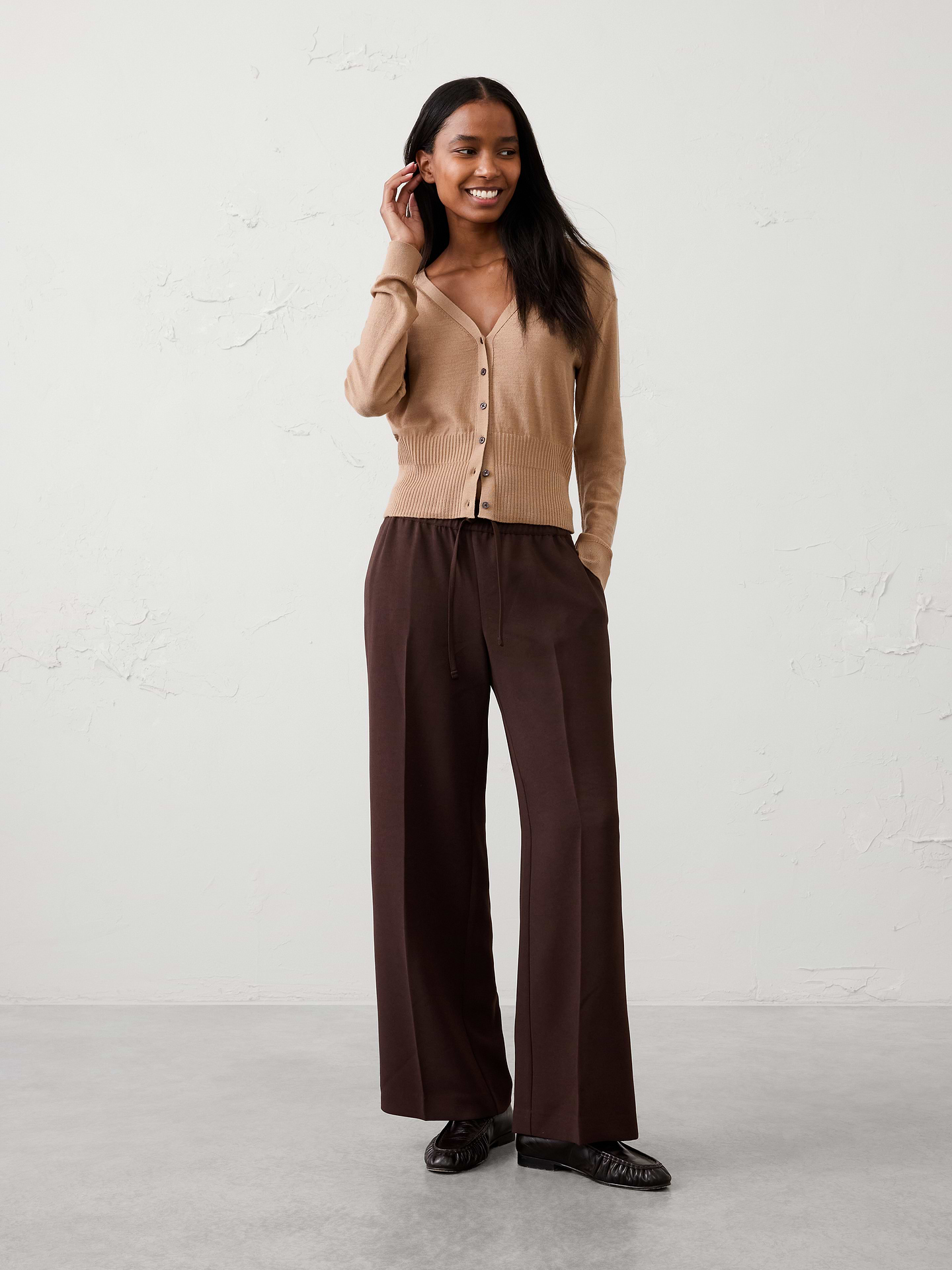 Image 1 of 3, The perfect blend of comfort and polish, this pull-on crepe pant is designed for effortless everyday versatility. Crafted from a fluid crepe fabric, it features a flattering mid-rise fit and a clean silhouette that transitions seamlessly from work to weekend. Whether dressed up with a blazer or styled casually with a knit top, this pant is a go-to staple for any occasion., SUSTAINABILITY: Made with 100% recycled polyester., Pull-on pant. Adjustable drawstring waistband., On-seam side pockets., Back welt pockets., Soft trouser crease., Made exclusively for Banana Republic Factory., Product #1182227