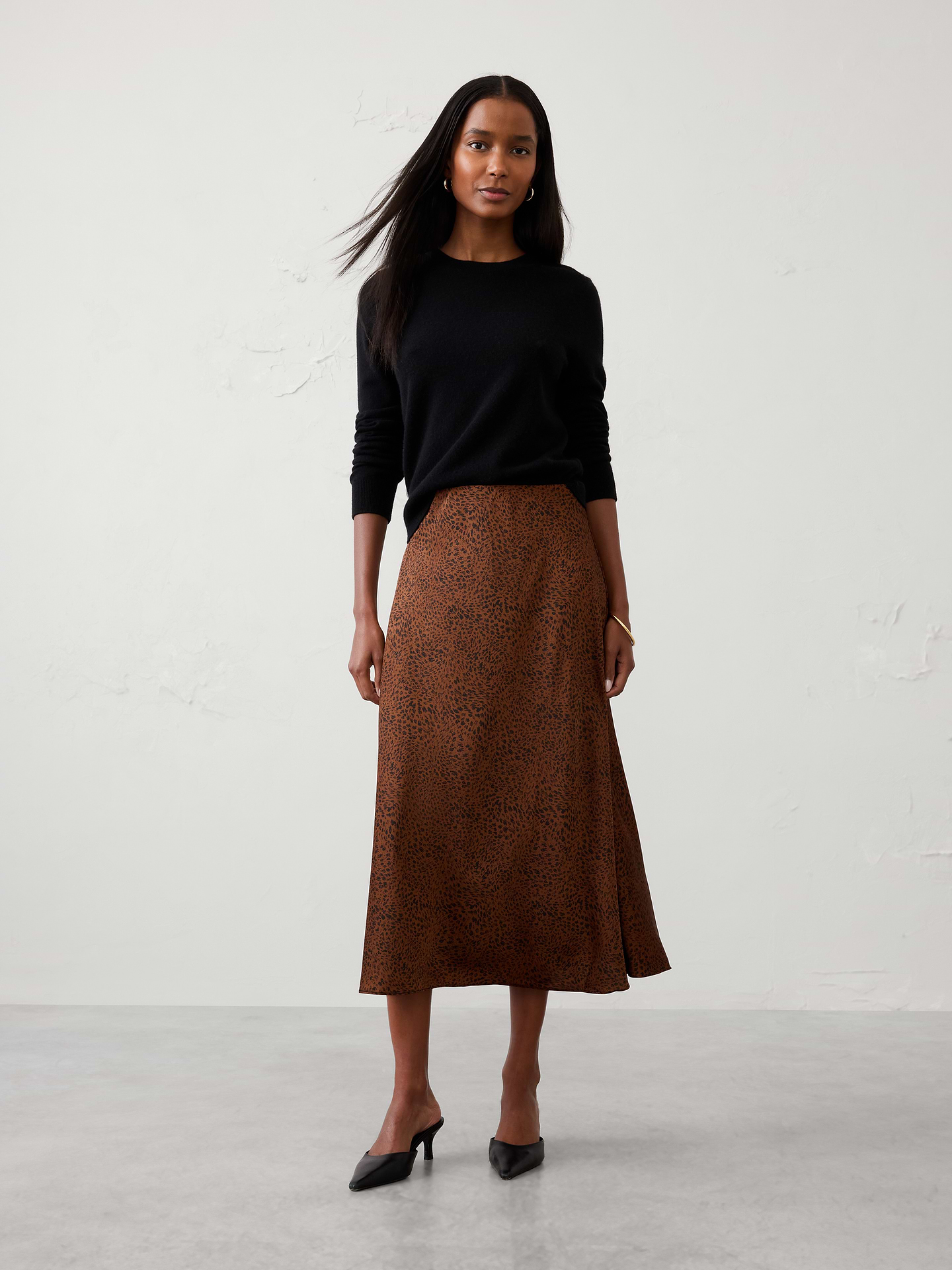 Image 1 of 4, Our best‑selling satin slip skirt is a timeless wardrobe essential, designed with a fluid silhouette and effortless drape. Elegant yet versatile, it’s the perfect piece for occasion dressing, easily styled up for special events or down for a more relaxed, polished look., Pull on skirt., Bias‑cut satin fabrication enhances fluid drape and movement., Flared hem creates a soft, flowing silhouette., Made exclusively for Banana Republic Factory., Product #1185762