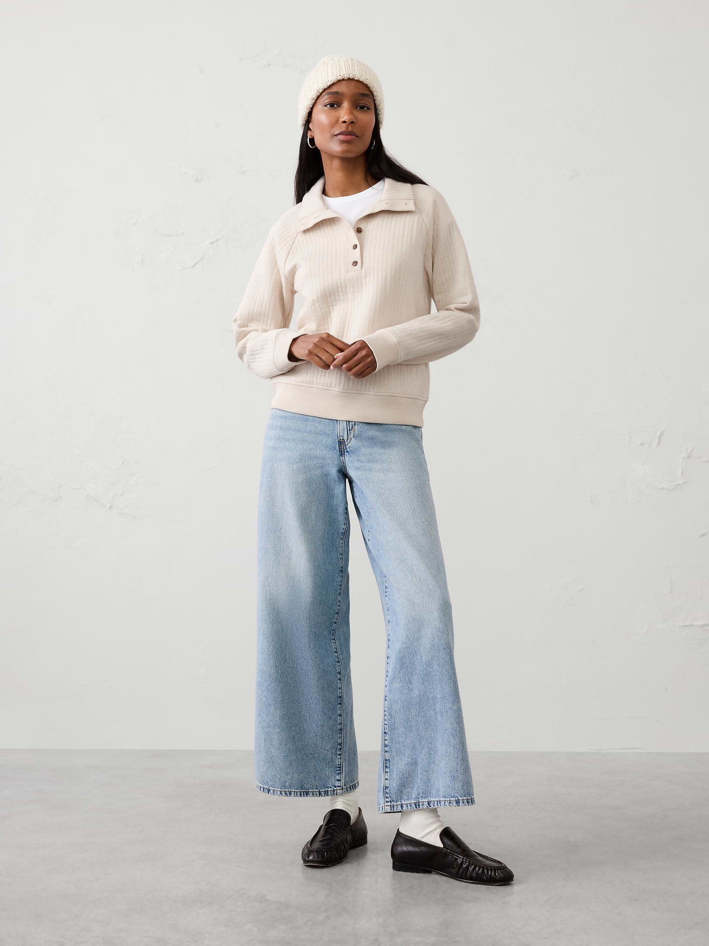 Image 1 of 4, Designed for effortless comfort, this quilted sweatshirt is soft, lightweight, and provides just the right amount of warmth. The textured quilted construction adds subtle dimension and visual interest, while the easy silhouette makes it a versatile layer for everyday wear. Not too heavy and never overcomplicated, it's the kind of comfortable staple you'll reach for again and again., Point collar with extended button henley placket., Long raglan sleeves., Made exclusively for Banana Republic Factory., To view a copy of this product’s label, copy the style number below and search this database Law Label Lookup <, Product #1185994