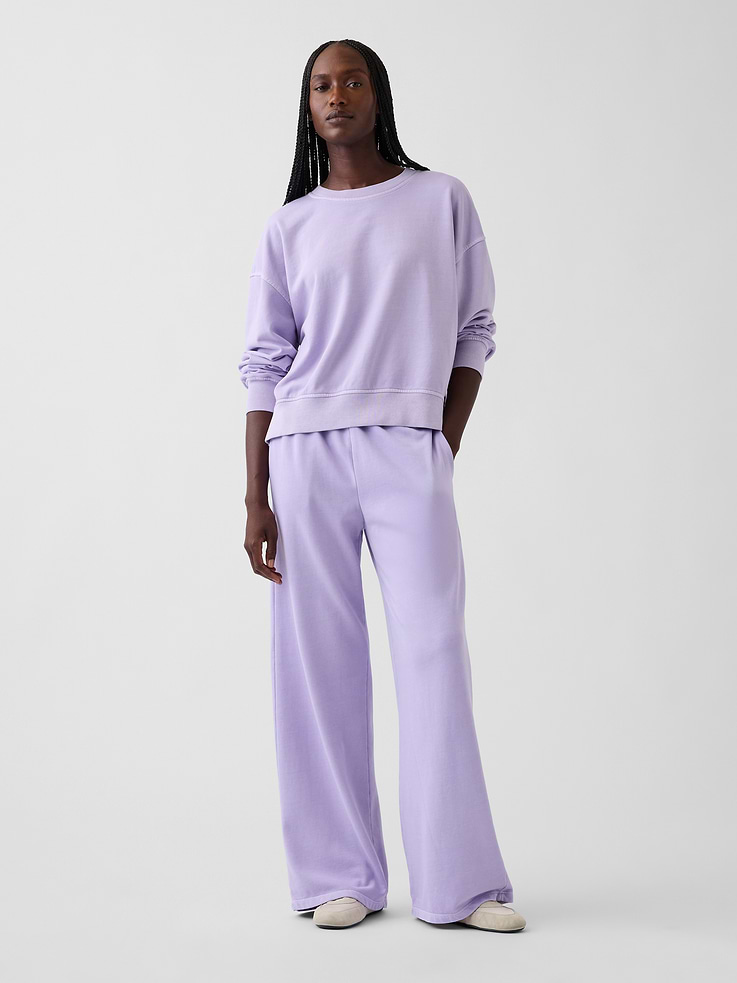 Image 1 of 6, Our signature softer than soft sweats — now in a light French Terry. Brushed outside. Textured inside. Feels better than vintage, from day one., Soft cotton-blend French terry loose sweatpants. In a relaxed fit with a wide leg., Elasticized waist with inner drawcords., Side on-seam pockets., Made with 52% Protocol cotton verified by the U.S. Cotton Trust Protocol, a program which works with farms committed to improving their environmental footprint by minimizing water usage and improving soil health (Claim No. 10127)., Made with 23% recycled polyester. Compared to virgin materials, using recycled materials helps reduce resource use and waste., Explore our GapSweats Guide ., Product #1185405