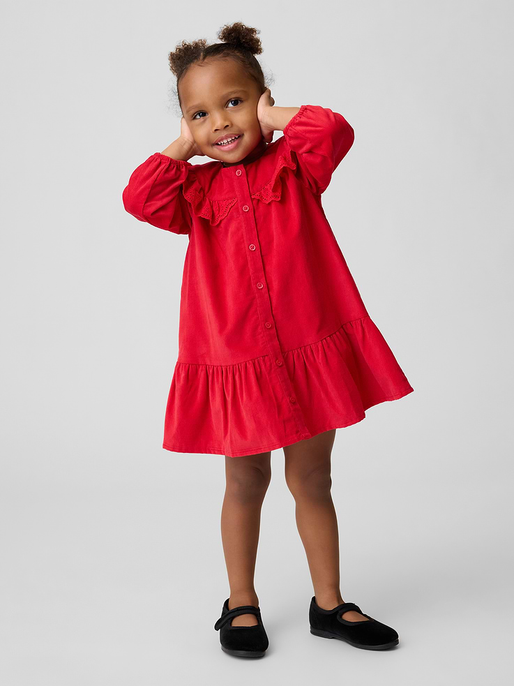 Image 1 of 3, Soft cotton corduroy button-up dress., Round collar, button front., Ruffled detail at yoke with embroidered eyelet detail and scalloped edge., Long sleeves with elasticized cuffs., Shirring at drop waist., Product #912220