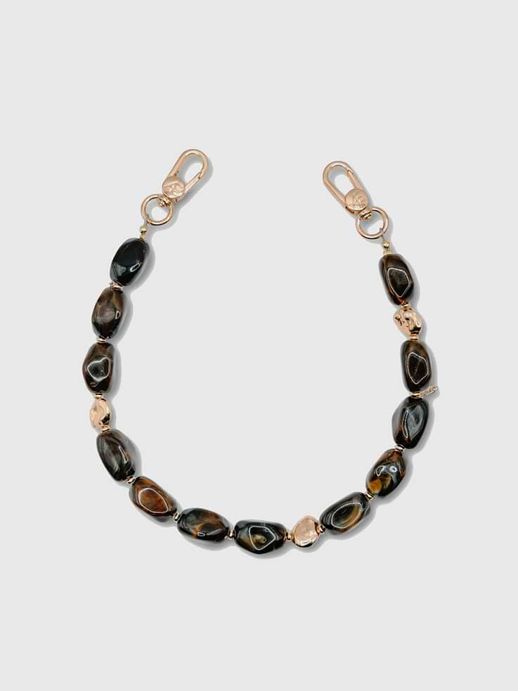 Image 1 of 2, Bold, sculptural, and effortlessly modern, the Lune Strap is handcrafted with irregular square resin stone beads and gold plated spacer accents, creating a striking contemporary look with natural movement and shine., Universal Phone Hitch required to attach to your phone case, sold separately., Over time, certain bead colors may lose their vibrancy due to exposure to air, water, and heat., Due to natural variations in gemstones and beads, product may differ slightly from displayed photos., THE CÆP in no way guarantees the integrity of your smartphone when using this strap.