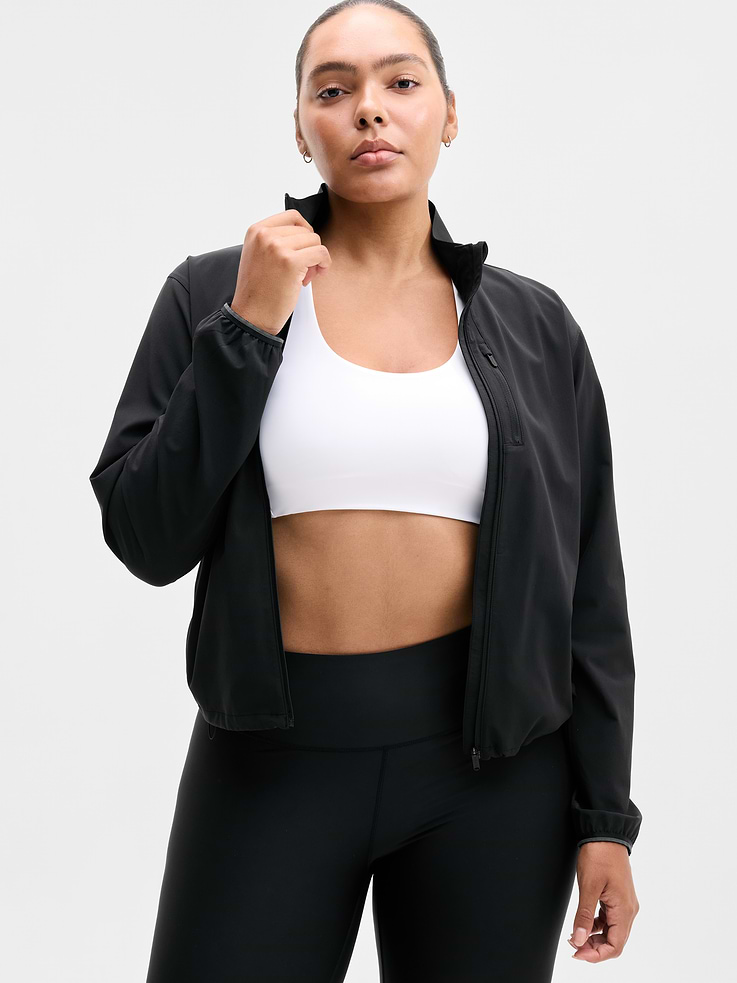 Image 1 of 4, FOR: Hitting your pace in nearly any place, from sidewalks to trailheads, FEEL: Recycled Featherweight Stretch fabric feels silky-sleek and light as air, FAVE: Bungee cord on hem makes customizing your fit a cinch, Secure zip pockets store your essentials, Ventilated back helps keep you cool, Thumbholes hold sleeves in place, Product #578072