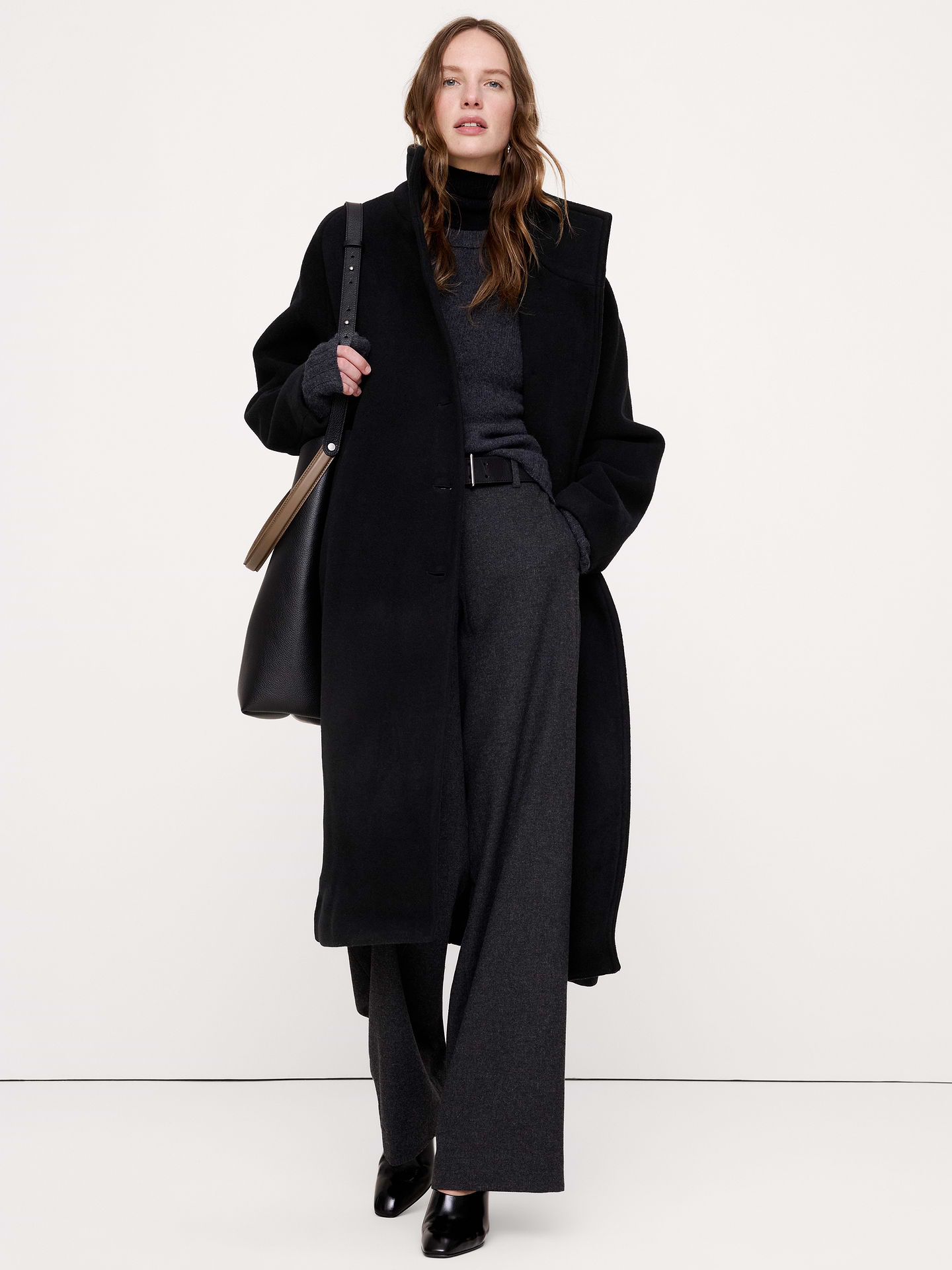 Image 1 of 7, A classic topcoat silhouette, crafted here in a heavier wool-blend from Italy's Manifattura Emmetex that we love for its felted texture and softness. Plus, we kept the fit relaxed to you can layer it over your heaviest sweaters through the cooler months., Ultra oversized fit: Extra room through chest, shoulders, and waist. Dropped shoulder seams., Fabric from Italy's Manifattura Emmetex., Stand collar with button front., Front pockets., Fully lined., Product #1180466