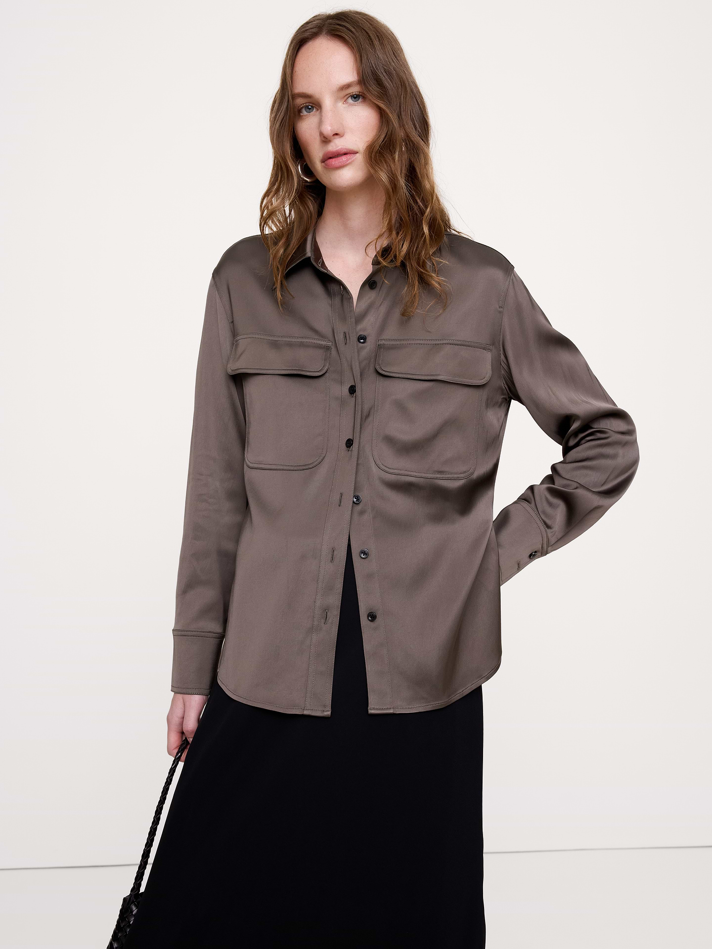 Image 1 of 8, An exploration of luxe utility, this oversized shirt has chest pockets for a utilitarian twist on the classic button-down shirt. Cut in a beautiful stretch-satin fabric., Oversized fit: Extra room through chest, shoulders, and waist. Dropped shoulder seams., Point collar with button front., Chest pockets., Shirttail hem., Product #1183797