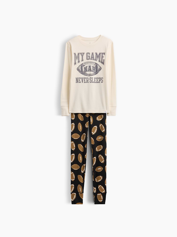 Image 1 of 3, Our comfiest PJs—now softer than ever. Cozy brushed cotton on the inside. All their favorite prints & colors on the outside., Soft cotton jersey pajama top and pants PJ set with a cozy brushed interior., Crewneck., Long sleeves., Elasticized waist at PJ pants., Banded cuffs., Allover print., Made with 100% organically grown cotton which is grown without the use of synthetic pesticides and fertilizers., This product was made in a factory that invests in gender equity and women’s empowerment through RISE. Learn more at gapinc.com/equity ., Product #915774