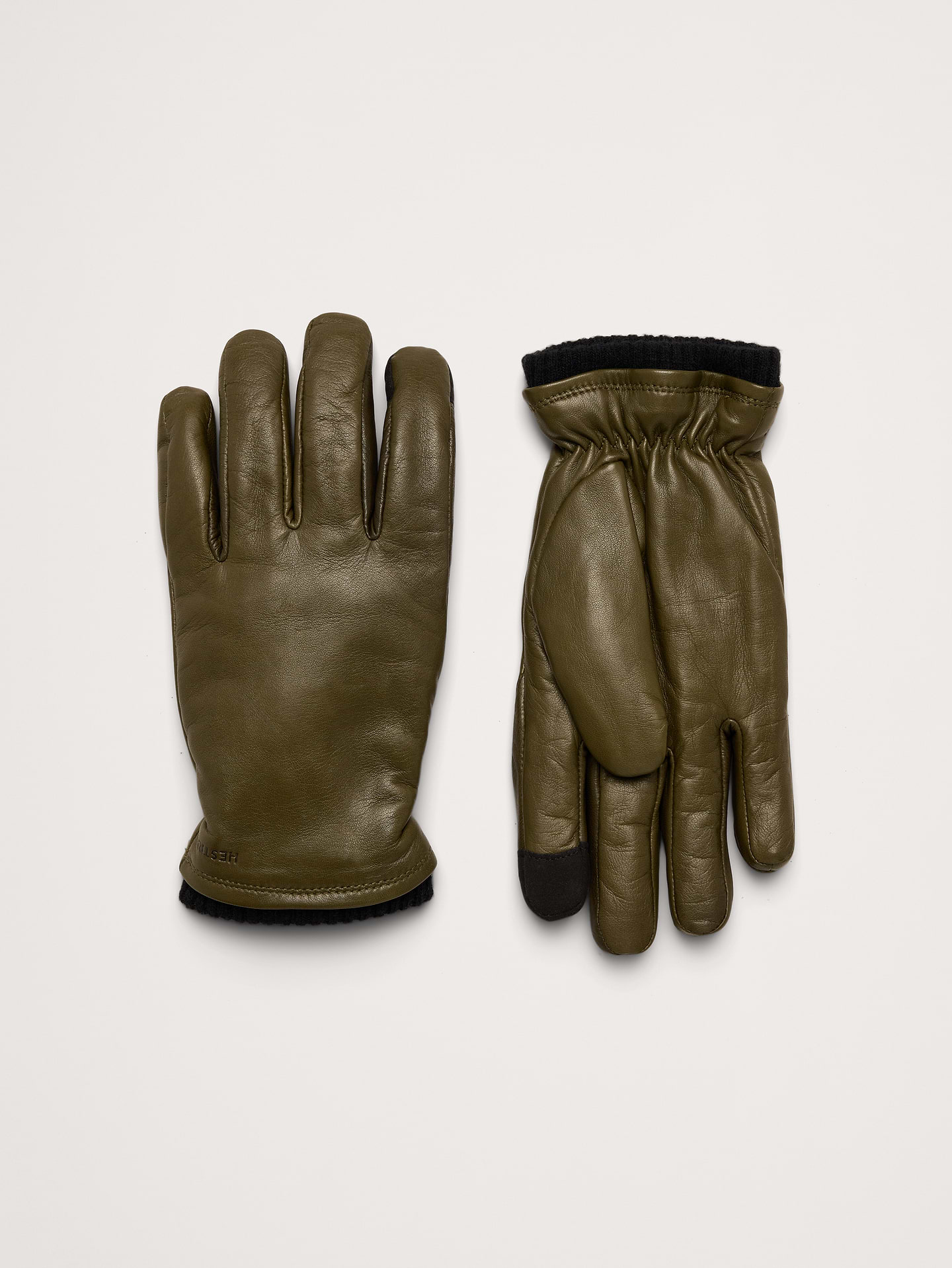 Image 1 of 2, A warm, minimalist glove with a pre-curved construction to allow for better dexterity. PrimaLoft Gold insulation keeps you warm on the coldest of days., Hestra: Family-run since 1936, crafting high-quality gloves in Sweden for all hand—from lumberjacks to skiers and now to you., Touchscreen functionality on the index and thumb., Fleece lining., Product #1180429