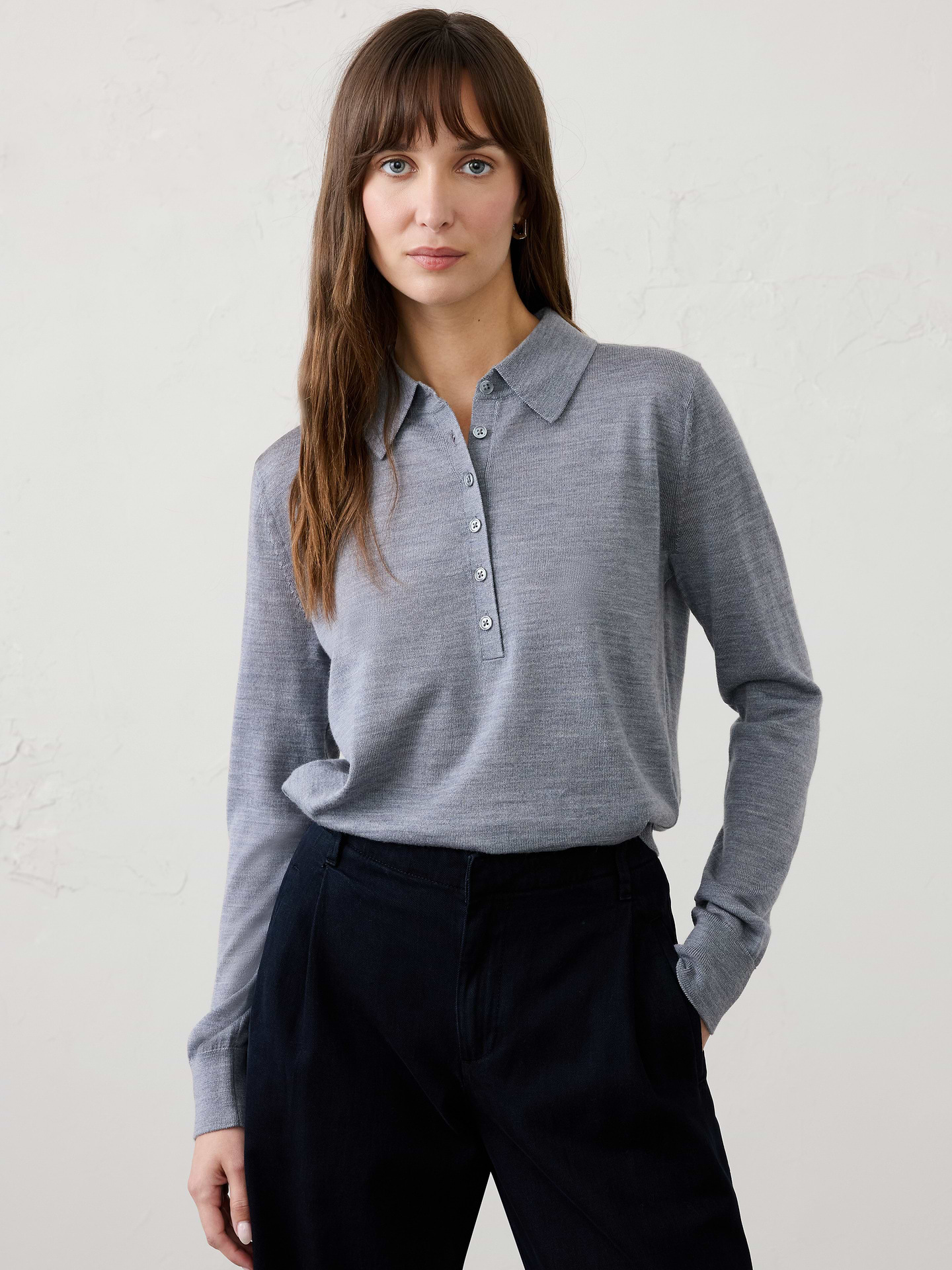 Image 1 of 1, Crafted from luxuriously soft Merino wool, this sweater offers lightweight warmth and natural breathability for all‑day comfort. Perfect for layering or wearing on its own, it delivers timeless versatility with an effortlessly refined finish., Polo collar. Long sleeves., Button placket., Ribbed arm cuffs and hem., Made exclusively for Banana Republic Factory., Product #1177059