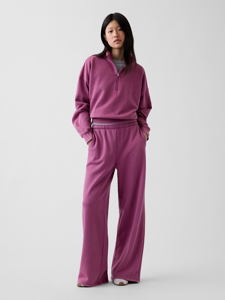 Image 1 of 6, Soft cotton-blend baggy sweatpants., Elasticized waist., Front slant pockets., This pant is made with 23% recycled polyester. Compared to virgin materials, using recycled materials helps to reduce resource use and waste., Note: Sugar plum neon pink styles require separate care instructions. The dye used in the crafting of this product is prone to crocking, or color transfer. Please avoid contact with light-colored fabric or upholstery., Explore our GapSweats Guide ., Product #732776