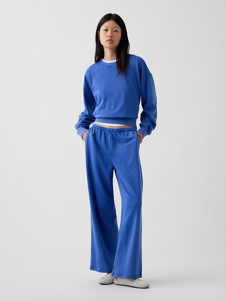 Image 1 of 6, Our signature softer than soft sweats — now in a light French Terry. Brushed outside. Textured inside. Feels better than vintage, from day one., Soft cotton-blend French terry loose sweatpants. In a relaxed fit with a wide leg., Elasticized waist with inner drawcords., Side on-seam pockets., Made with 52% Protocol cotton verified by the U.S. Cotton Trust Protocol, a program which works with farms committed to improving their environmental footprint by minimizing water usage and improving soil health (Claim No. 10127)., Made with 23% recycled polyester. Compared to virgin materials, using recycled materials helps reduce resource use and waste., Explore our GapSweats Guide ., Product #1185405