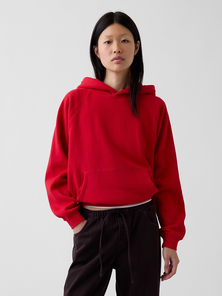 Image 1 of 6, Soft cotton-blend hoodie., Hooded neckline., Long sleeves., Kanga pocket., Banded hem., Note: Sugar plum neon pink styles require separate care instructions. The dye used in the crafting of this product is prone to crocking, or color transfer. Please avoid contact with light-colored fabric or upholstery., Made with 23% recycled polyester. Compared to virgin materials, using recycled materials helps reduce resource use and waste., Explore our GapSweats Guide ., Product #523562