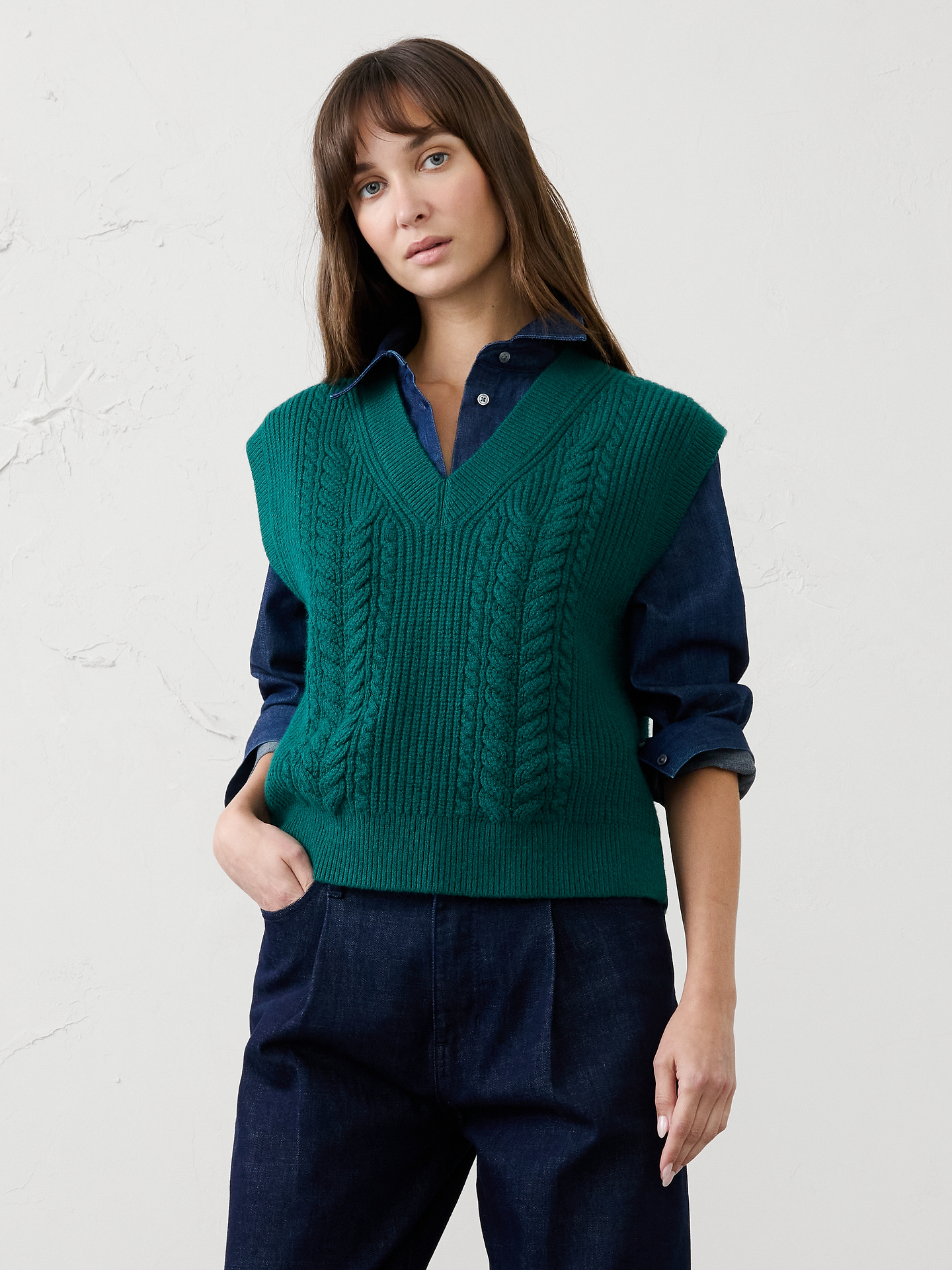 Image 1 of 4, Our sweater is knit from our signature Perfectly Soft yarn—a luxurious blend of cotton with a hint of wool, that feels as cozy as it looks. Classic cable stitching adds timeless texture and dimension, elevating the clean silhouette with a heritage‑inspired touch., V-neckline. Cap sleeves., Ribbed neck, arm cuffs and hem., Made exclusively for Banana Republic Factory., Product #1177098