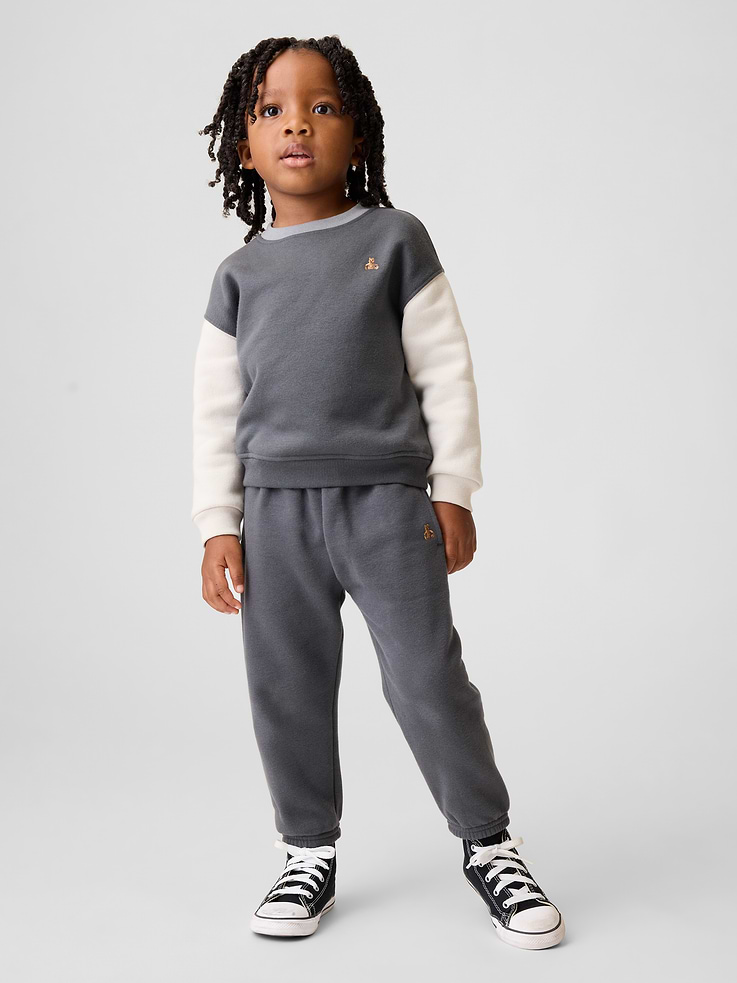 Image 1 of 4, Our softer than soft sweats. Brushed on the inside. Smooth on the outside. Made so that no two are alike., Soft cotton-blend relaxed joggers., Elasticized waist., Front slant pockets., Embroidered Brannan Bear at hip., This product was made in a factory that invests in gender equity and women’s empowerment through RISE. Learn more at gapinc.com/equity ., Product #515110