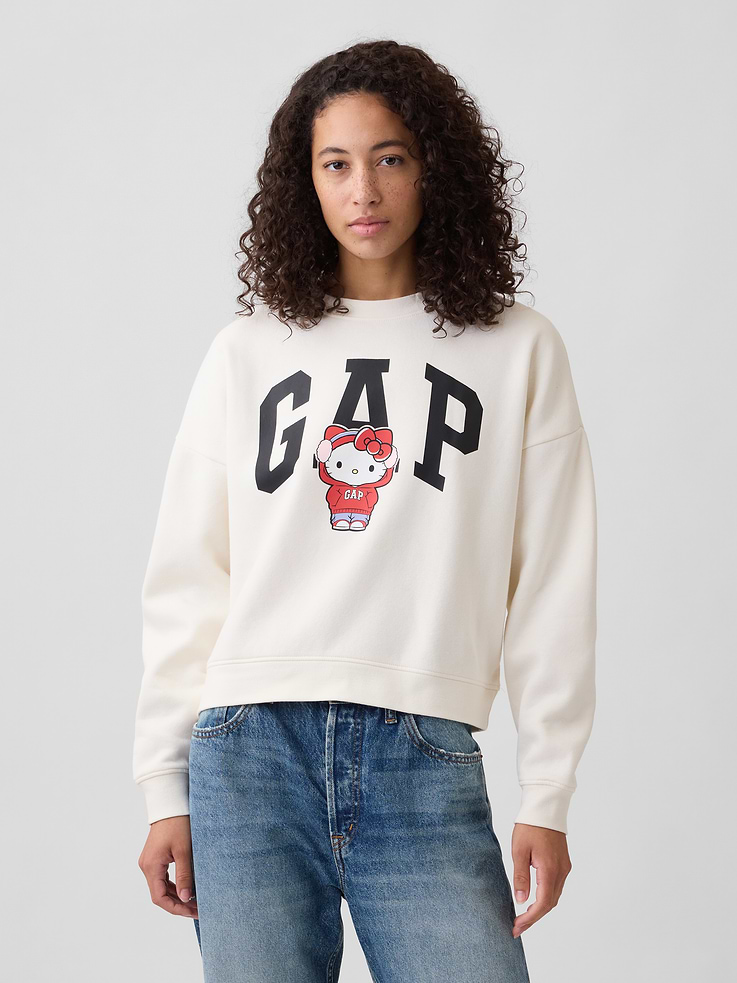 Image 1 of 5, Soft, comfy fleece., Dropped shoulder, long sleeves with banded cuffs., Crewneck., Gap logo with graphic at front., Banded wedge hem., Product #1174939