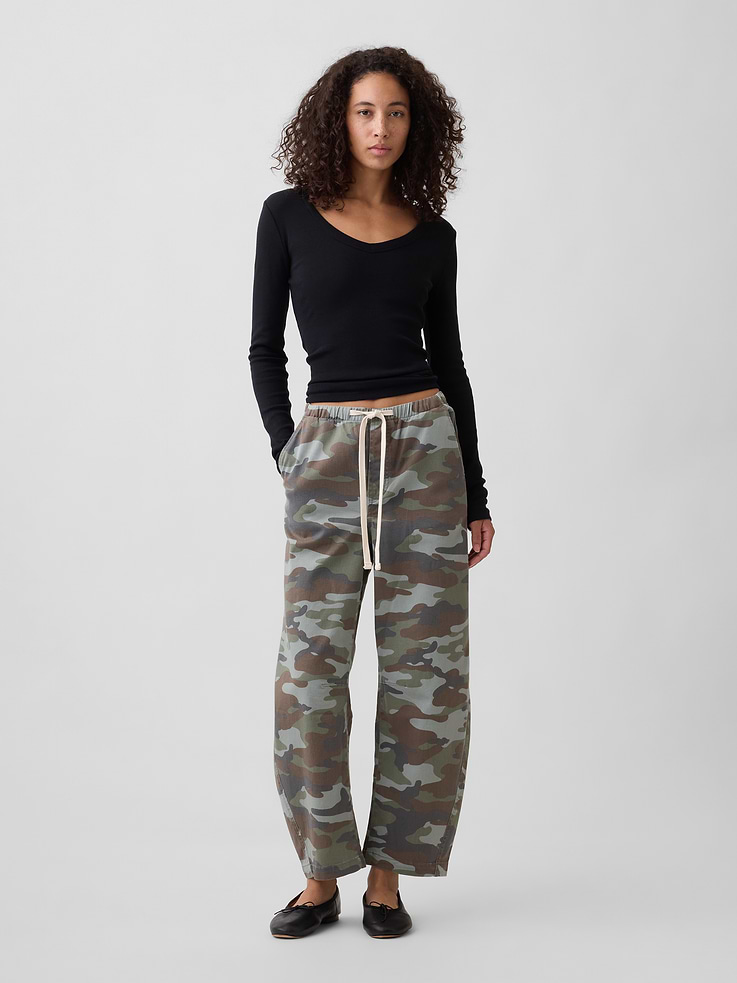 Image 1 of 7, This product is part of our water-saving Washwell program. Compared with conventional wash methods, Washwell uses at least 20% less water., Stretch denim., Color wash., Drawcord ties at elasticized waist, faux fly., Front slant pockets, patch pockets at back., Allover camo print., This product was made in a factory that invests in gender equity and women’s empowerment through RISE. Learn more at, Product #1185748