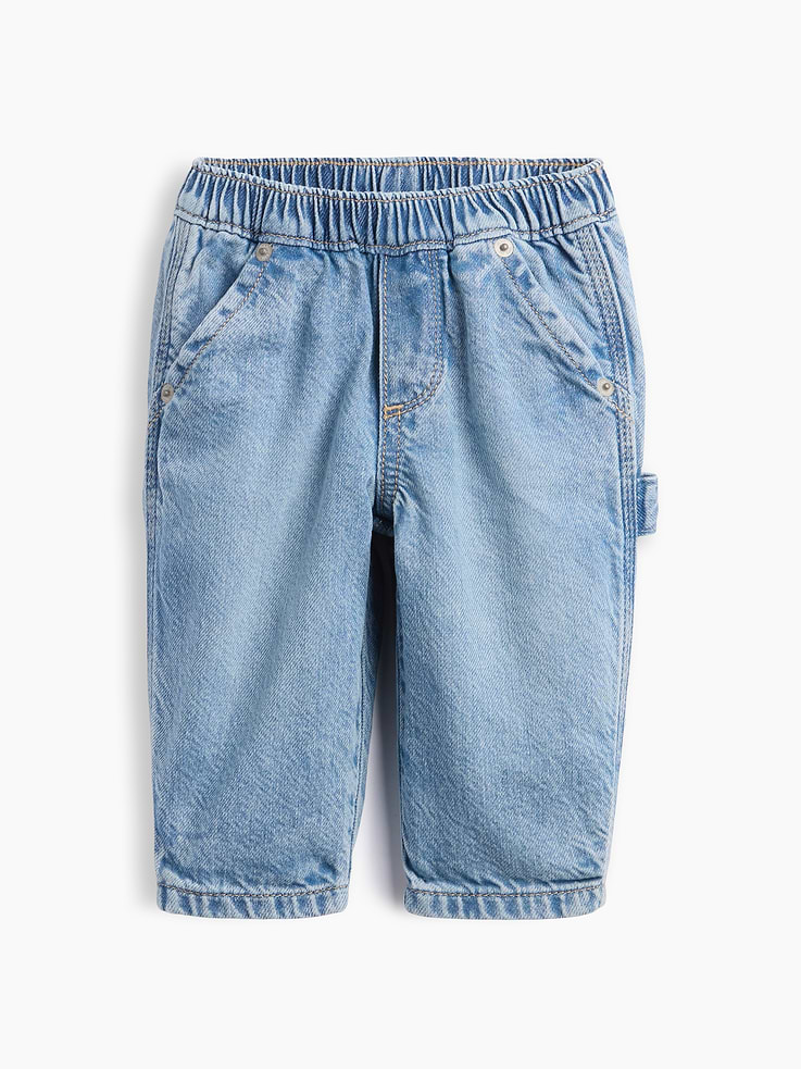 Image 1 of 2, Soft cotton denim pull-on carpenter jeans., Elasticized waist with faux fly., Side slant pockets, back patch pockets., Carpenter hammer loop at side., Light wash., Responsibly Made: This pair of jeans is part of our water-saving Washwell program. Compared with conventional wash methods, Washwell uses at least 20% less water., More Sustainable Cotton: Made with 5% recycled cotton. Compared to virgin materials, using recycled materials helps reduce resource use and waste., Explore our babyGap Guide ., This product was made in a factory that invests in gender equity and women’s empowerment through RISE. Learn more at gapinc.com/equity ., Product #1185608