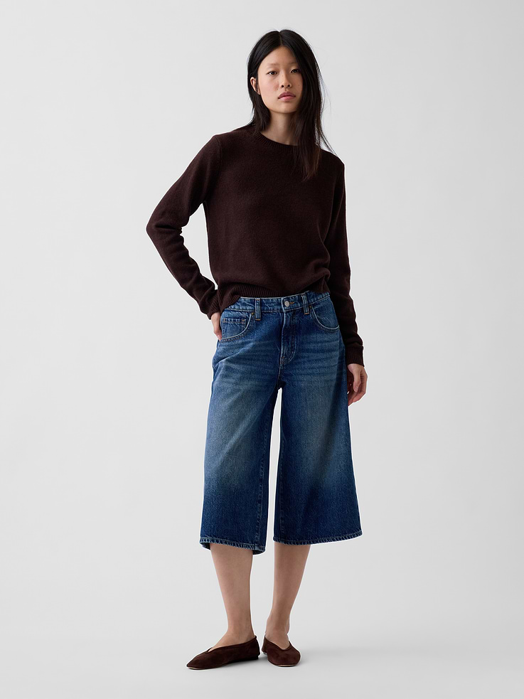 Image 1 of 6, Fit: A culotte jean that's fitted at the waist with a relaxed leg. In a cropped length that hits just below the knee., Fabric: 100% Cotton., Stretch: No Stretch Jeans. Authentic denim that gets better with every wear. Made to wear all day & break in over time., Look: A classic five-pocket barrel-leg culotte jean in a medium wash., Details: Zip fly & five-pocket styling, Responsibly Made: This pair of jeans is part of our water-saving Washwell program. Compared with conventional wash methods, Washwell uses at least 20% less water., More Sustainable Cotton: Made with 5% recycled cotton. Compared to virgin materials, using recycled materials helps reduce resource use and waste., Explore our GapJeans Guide ., Product #1194451