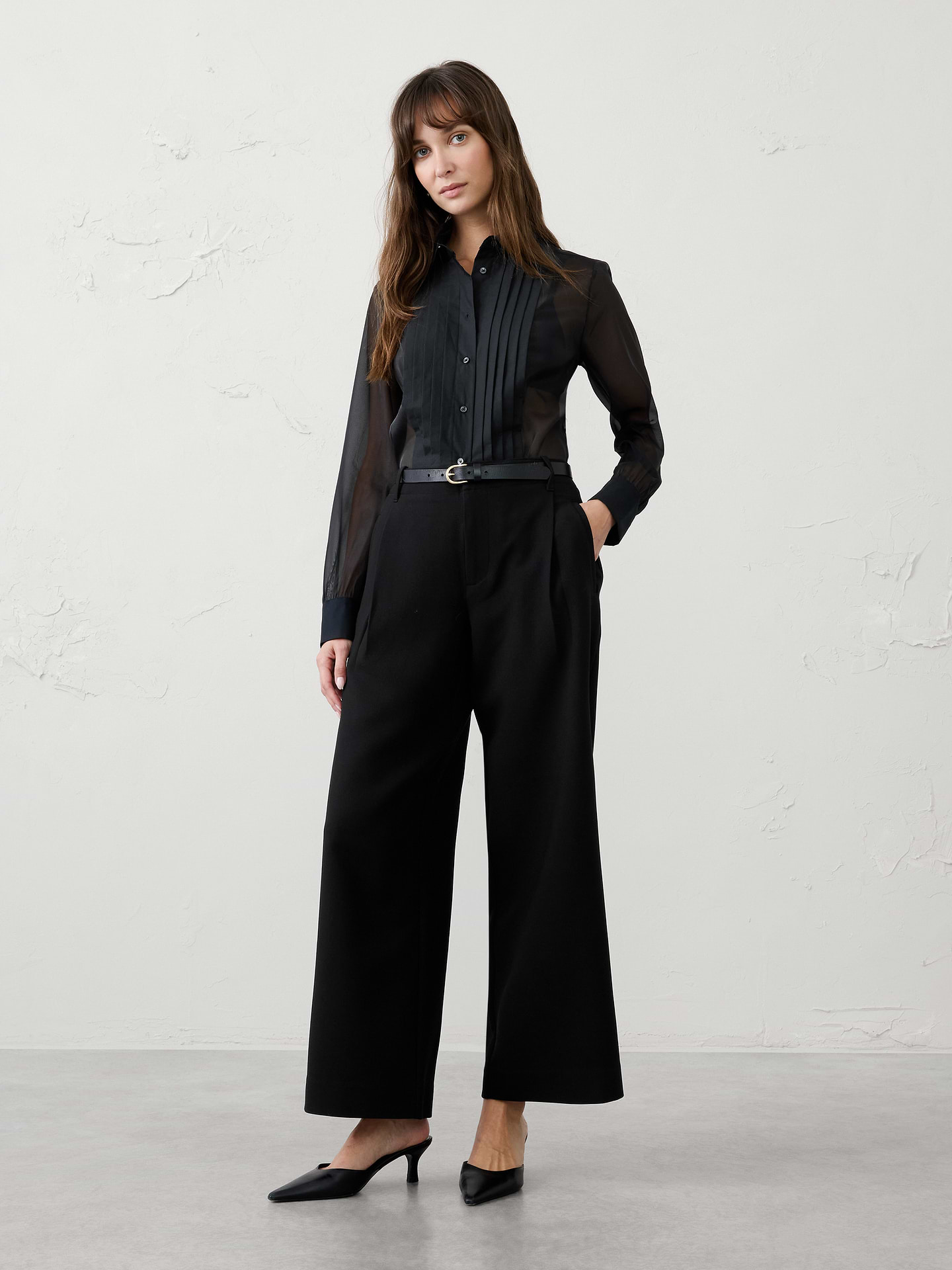 Image 1 of 3, This pant is crafted from our substantial heavy bistretch fabric for structure, comfort, and all‑day wearability. A subtle front pleat adds a tailored touch, creating a polished look that's perfect for the back half of the year. Versatile and refined, it pairs effortlessly with everything from sweaters and blouses to tailored jackets., SUSTAINABILITY: Made with 77% recycled polyester., Classic fit. Mid rise. Wide leg. Full length., Hook-and-bar closure with zip fly. Belt loops., Front pleat detailing., Vertical welt front pockets., Back welt pockets., Back waist darts., Made exclusively for Banana Republic Factory., Product #1182233