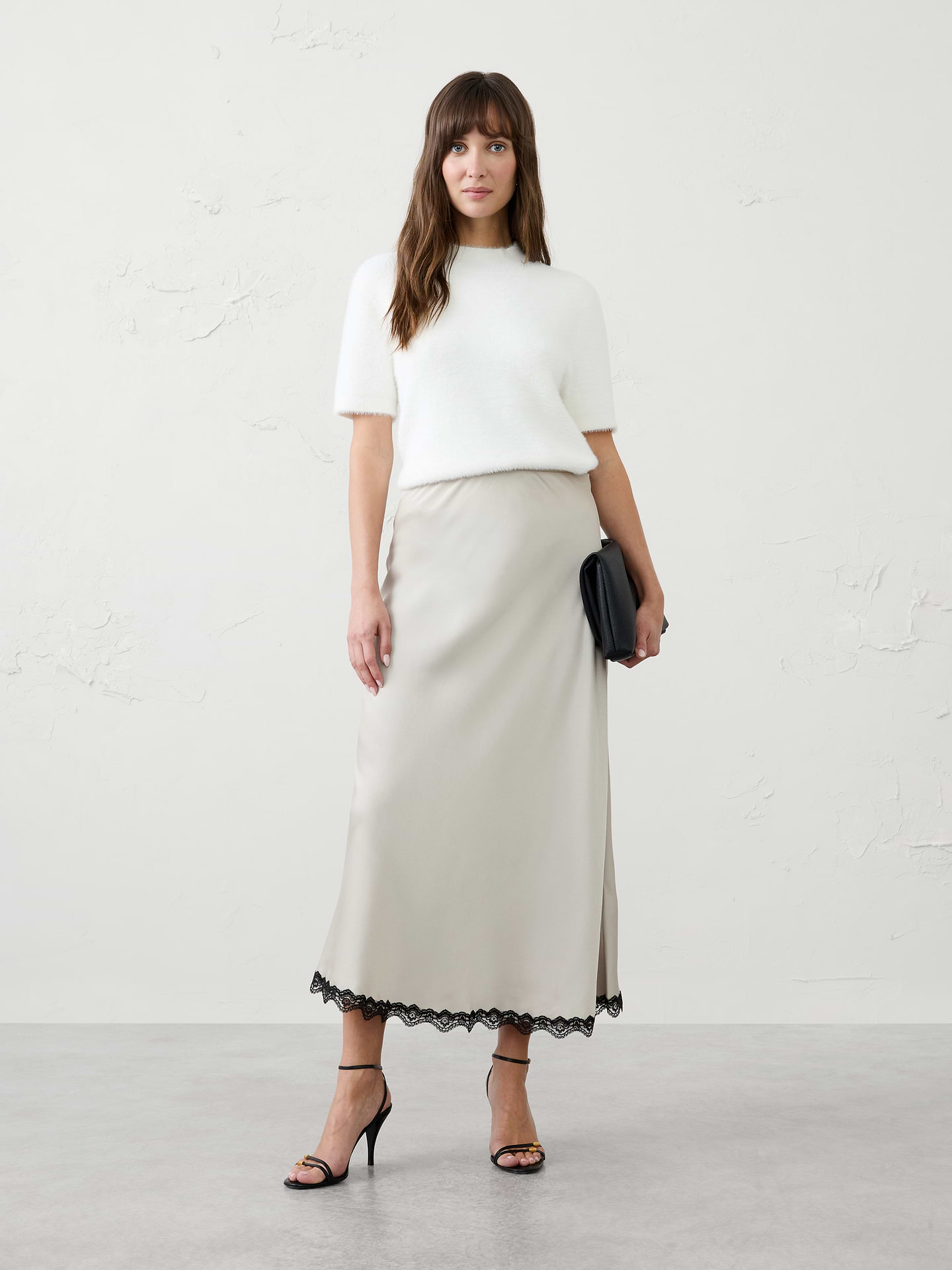 Image 1 of 1, An elevated take on a customer favorite, our satin lace-trim midi skirt combines effortless sophistication with feminine charm., Pull on skirt., Skims the body., Delicate lace trim at the hem., Made exclusively for Banana Republic Factory., Product #1185761