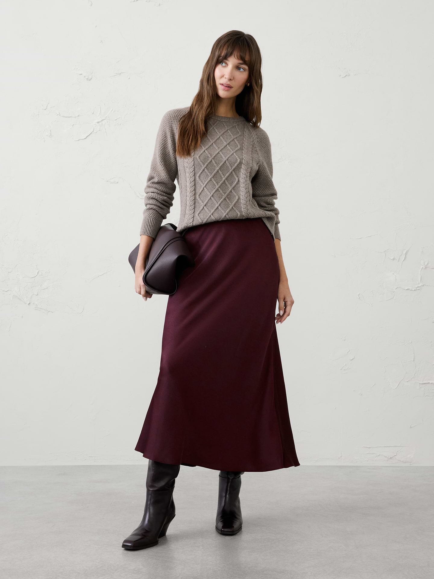 Image 1 of 4, Our best‑selling satin slip skirt is a timeless wardrobe essential, designed with a fluid silhouette and effortless drape. Elegant yet versatile, it’s the perfect piece for occasion dressing, easily styled up for special events or down for a more relaxed, polished look., Pull on skirt., Bias‑cut satin fabrication enhances fluid drape and movement., Flared hem creates a soft, flowing silhouette., Made exclusively for Banana Republic Factory., Product #1185762