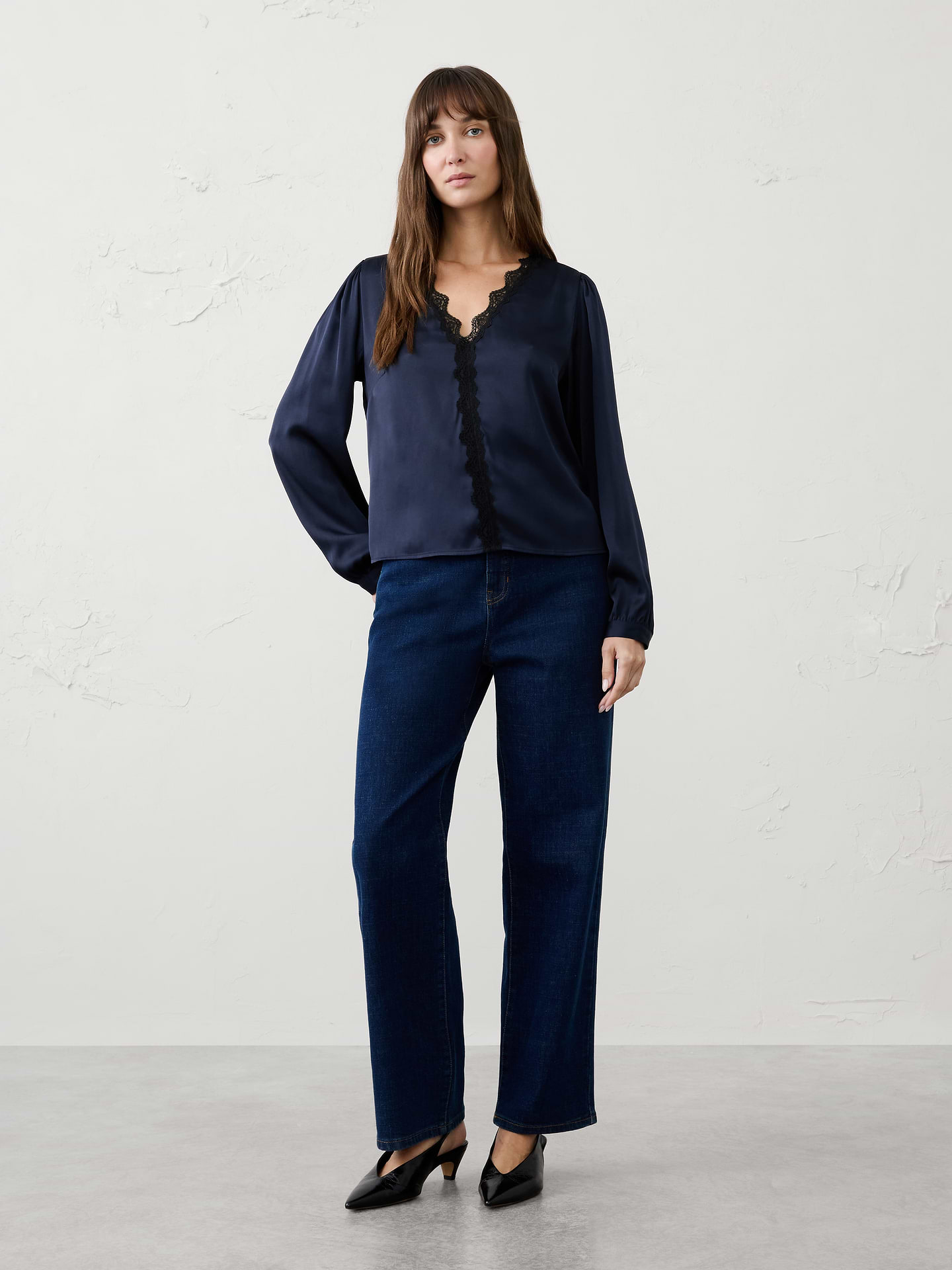 Image 1 of 5, Romantic lace details bring an elevated feel to this feminine blouse, making it a perfect choice for holiday celebrations and special occasions. Delicate trim and soft draping create an effortlessly polished look that transitions beautifully from dinner parties to evening events., V‑neckline. Long blouson sleeves with buttoned cuffs., Scalloped lace trim frames the neckline extending down the front., Made exclusively for Banana Republic Factory., Product #1185900