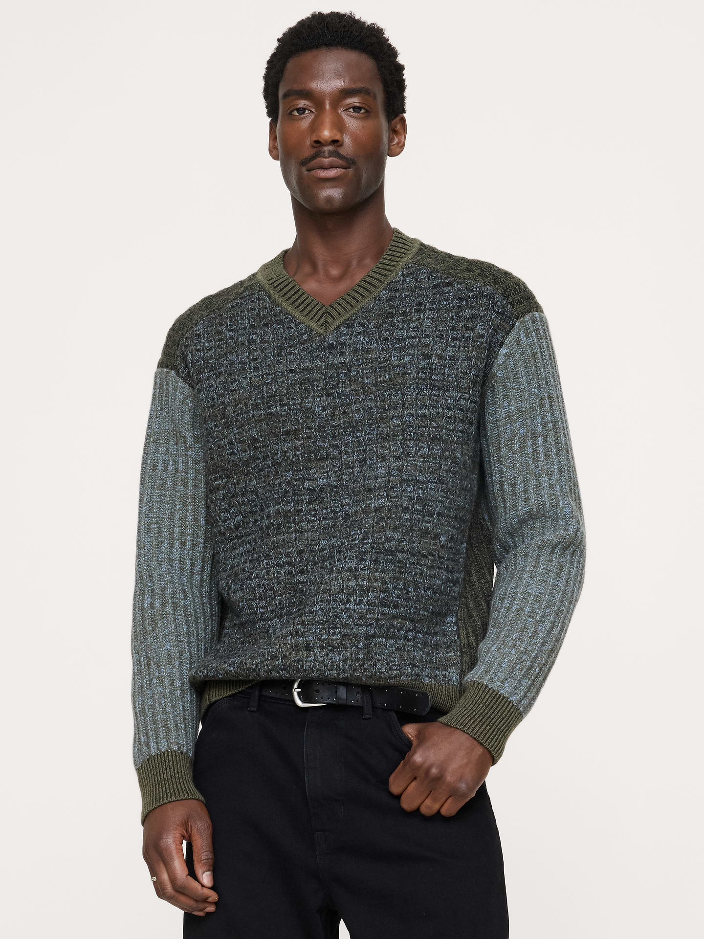 Image 1 of 7, This V-neck sweater takes its shape from the moto jacket. We cut it from Merino wool with the same diagonal seams that made the original iconic., Standard Fit: A straight and easy fit., V-neck., Straight hem., Product #906716