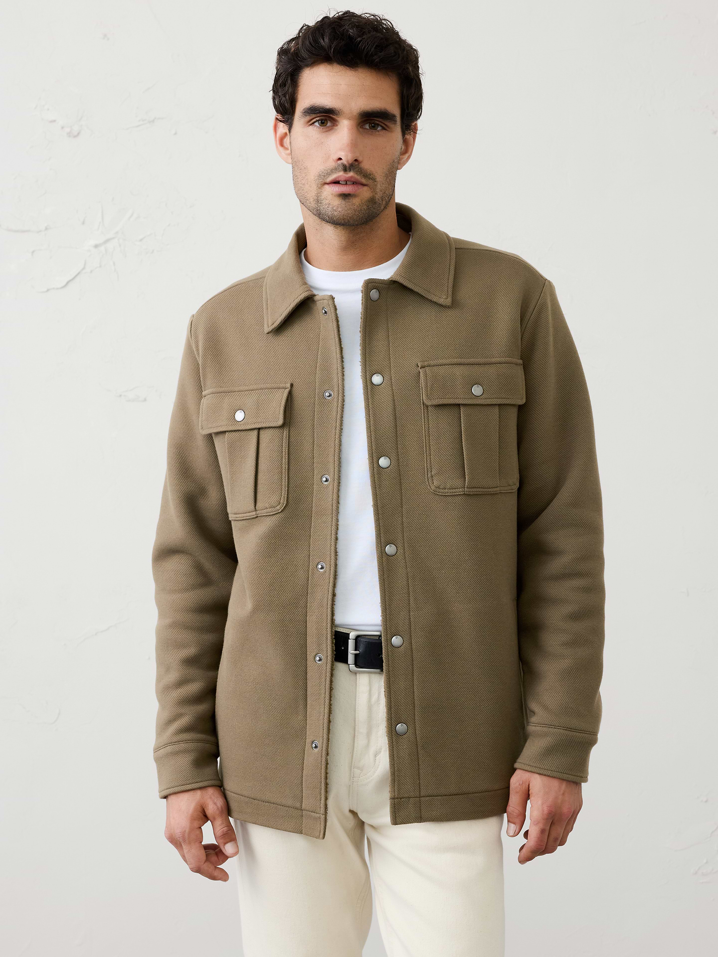 Image 1 of 3, Designed for exceptional comfort, this shirt jacket features a cozy sherpa lining that adds warmth and softness throughout., Point collar. Long sleeves with snap cuffs., Snap-front closure., Side-entry pockets., Chest pockets., Made exclusively for Banana Republic Factory., Product #1181076