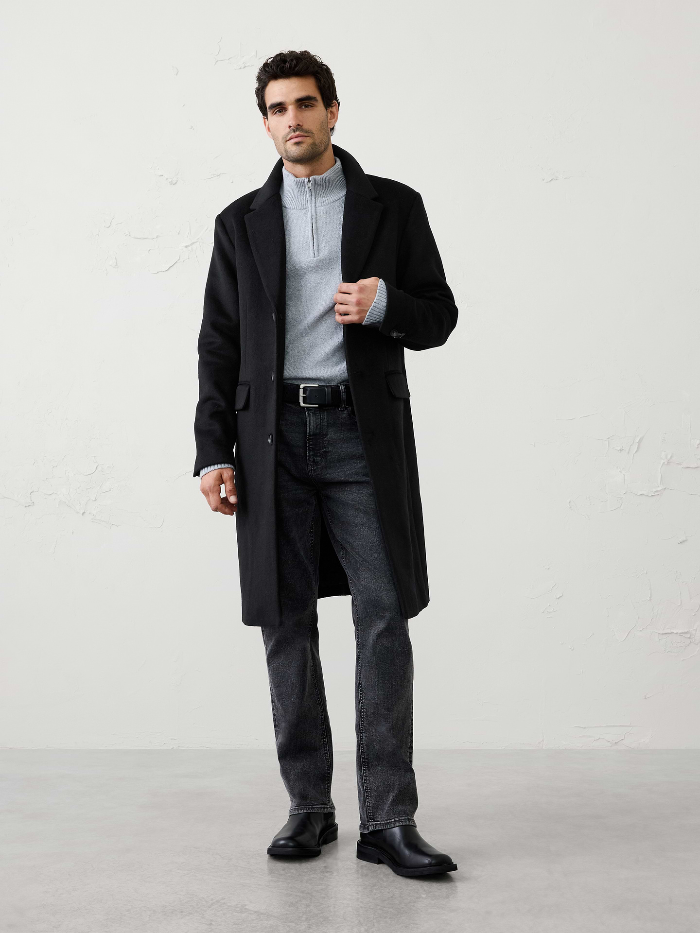 Image 1 of 3, Designed in a classic wool fabrication, this overcoat offers a clean, tailored look with a relaxed fit through the body. Warm, refined, and endlessly versatile, it's an easy layer that instantly elevates both casual and dressier outfits., Notched lapel collar. Long sleeves with buttons at the cuffs., Three‑button closure., Flap front pockets., Center back vent., Made exclusively for Banana Republic Factory., Product #1175503