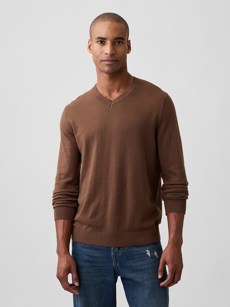 Image 1 of 5, Soft cotton knit., Long sleeves with ribbed cuffs., V-neck., Ribbed hem., This product was made in a factory that invests in gender equity and women’s empowerment through RISE. Learn more at, Product #1178478