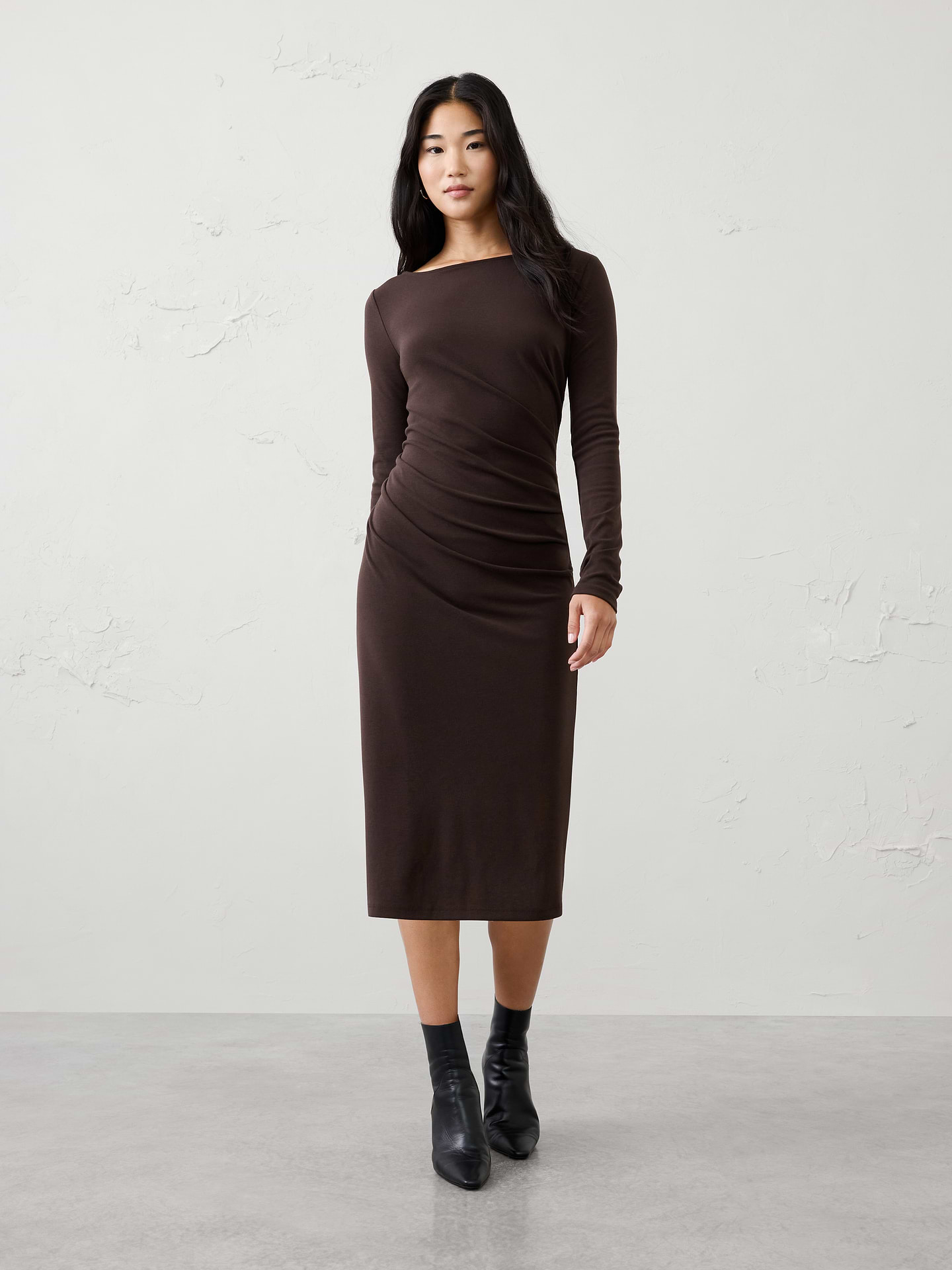 Image 1 of 3, Crafted in our customer‑favorite Cozy Rib fabric, this midi dress is elevated with flattering asymmetric draping that creates an effortlessly sculpted silhouette. Soft stretch and refined detailing make it an easy choice for day‑to‑night dressing., SUSTAINABILITY: Made with 60% recycled polyester., Wide boat neckline. Long sleeves., Asymmetrical draped panel overlays the front bodice for a flattering effect., Fitted at the waist., Straight skirt silhouette creates a refined, elongated look., Made exclusively for Banana Republic Factory., Product #1185682