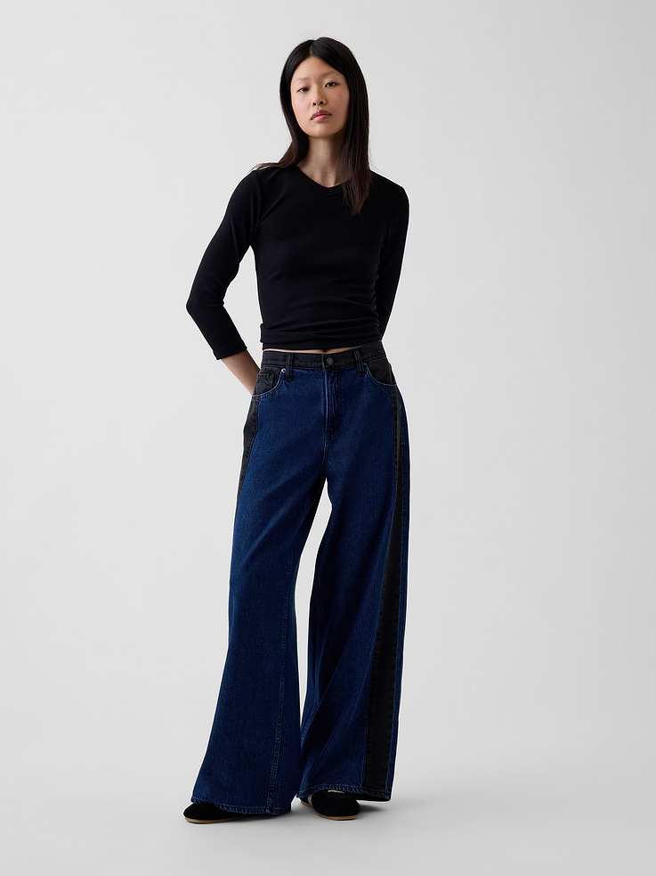 Image 1 of 6, Fit: A full-length baggy jean that's fitted on the waist & relaxed all the way down. ​, Fabric: 55% Cotton, 40% Lyocell, 5% Recycled Cotton., Stretch: No Stretch Jeans. Authentic denim that gets better with every wear. Made to wear all day & break in over time.​, Rise: Mid Rise Jeans., Look: A five-pocket baggy jean in a two-toned dark wash. ​, Details: Zip fly, five-pocket styling, & tonal stripe at side seams., Responsibly Made: This pair of denim is made with 5% recycled cotton and is part of our water-saving Washwell program. Compared with conventional wash methods, Washwell uses at least 20% less water., Product #1185266