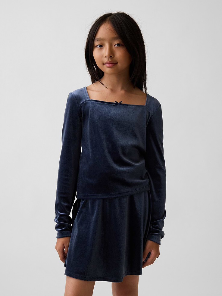 Image 1 of 5, Soft, stretch velour top., Square neck with bow detail., Long sleeves., This product was made in a factory that invests in gender equity and women’s empowerment through RISE. Learn more at gapinc.com/equity ., Product #1189030