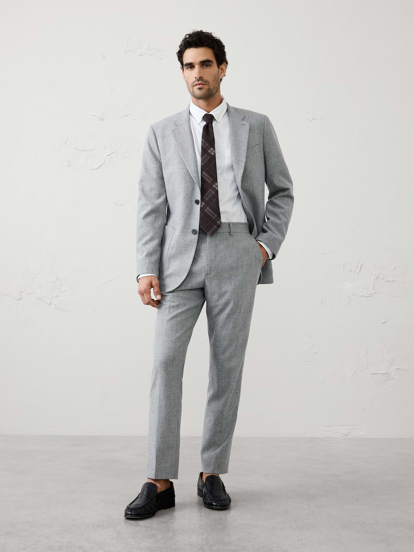Image 1 of 3, Featuring a subtle Donegal texture, this light grey suit trouser brings added dimension to a timeless silhouette. Designed to be worn together with the matching jacket or mixed into your wardrobe, it provides a polished foundation that pairs seamlessly with shirting, knitwear, and other refined layers., Extended button closure with zip fly. Belt loops., Front off-seam pockets. Double welt buttoned back pockets., Soft trouser crease., Matching suit jacket available., Wear it as a full suit or break it apart to maximize versatility., Made exclusively for Banana Republic Factory., Product #1175887