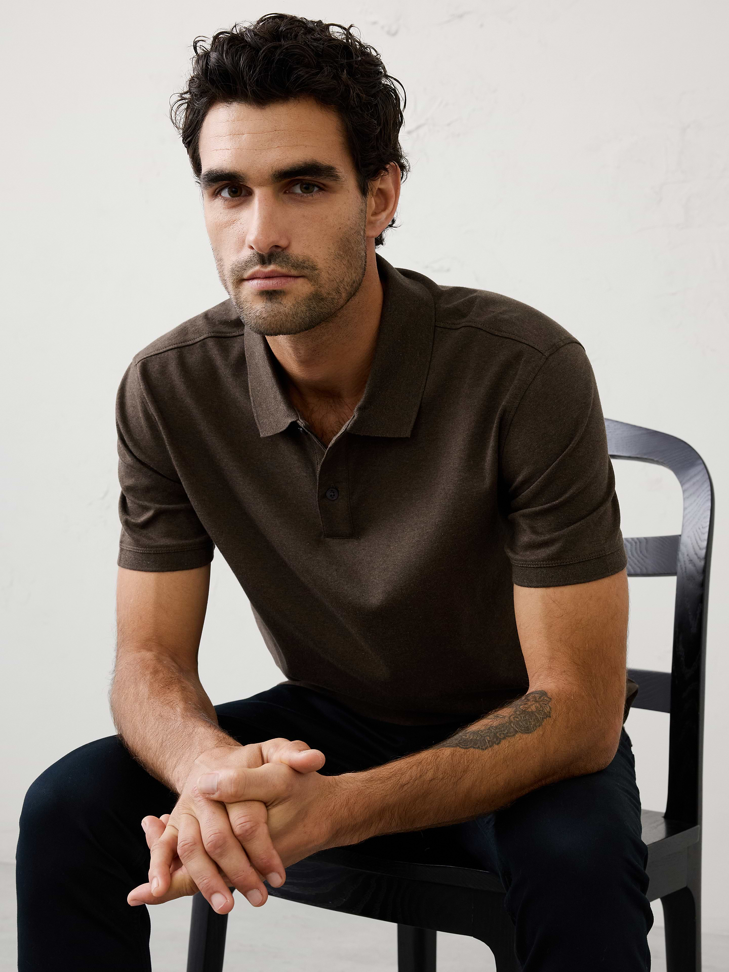 Image 1 of 8, Made with 100% cotton interlock, which is extremely soft, firm, and absorbent. Mercerization treatment gives this fabric a silk-like lustrous appearance for a polished look and hand feel, adding strength and reducing shrinkage., Polo collar with button placket. Short sleeves., Straight hem with side vents., Made exclusively for Banana Republic Factory., Product #667172