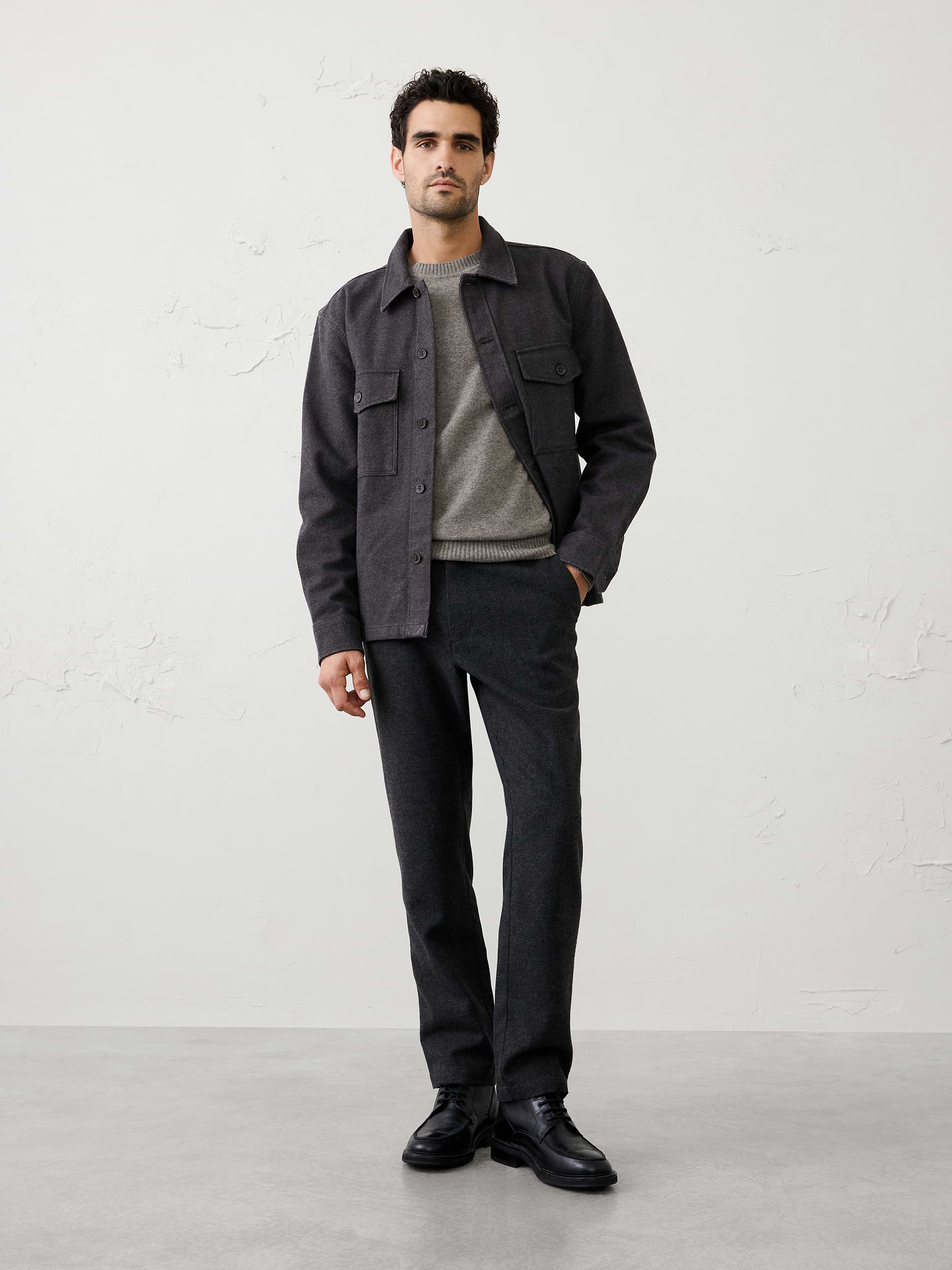 Image 1 of 3, A customer favorite returns in an easy, relaxed silhouette, crafted with heritage‑inspired herringbone texture for timeless appeal. The versatile weight makes it an ideal layering piece, offering a polished alternative to heavier jackets as temperatures begin to cool., Point collar. Long sleeves with adjustable button cuffs., Button front closure., Dual chest patch pockets with flap buttoned closure., Back yoke seam., Straight hem with side seam slits., Made exclusively for Banana Republic Factory., Product #1179775