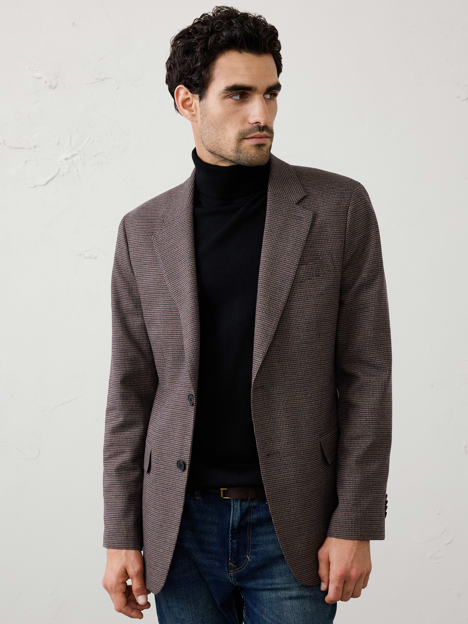 Image 1 of 3, A refined mini check pattern adds subtle dimension to this rich wineberry jacket, creating a modern interpretation of classic tailoring. The deep seasonal color brings confident character while remaining versatile enough to wear as part of a suit or styled separately. Designed with a clean, structured silhouette, it pairs effortlessly with neutral trousers, denim, or the coordinating pant for an elevated everyday look., Notch collar with button hole on wearers left panel. Four non-functioning buttons at cuffs., Two-button front closure., Front pockets. Chest pocket., Internal pockets., Double back vent., Fully lined., Matching suit trouser available., Wear it as a full suit or break it apart to maximize versatility., Made exclusively for Banana Republic Factory., Product #1179681