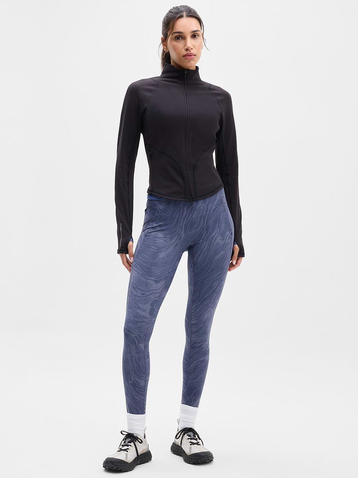 Image 1 of 5, FOR: Your toughest cold-weather training sessions, FEEL: Plush SuperSonic has a brushed interior with supportive compression, FAVE: Reflective details for workouts at dawn or dusk, Secure side zip pockets with a new earbud pocket, Continuous drawstring, Our #1 cold-weather legging is back with a new refined fit. Featuring no front seam, modernized lines, and more reflectivity., Product #1179294