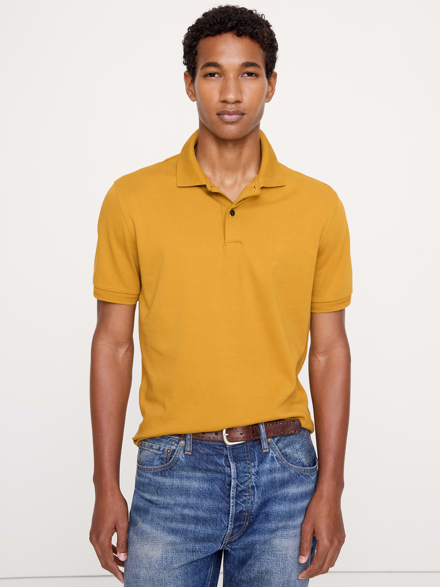 Image 1 of 8, Our tried-and-true Luxury Touch polo—beloved for its signature softness and dressed-up appearance., Standard Fit: A straight and easy fit., Polo collar., Button placket., Straight hem with vented sides., Product #811423