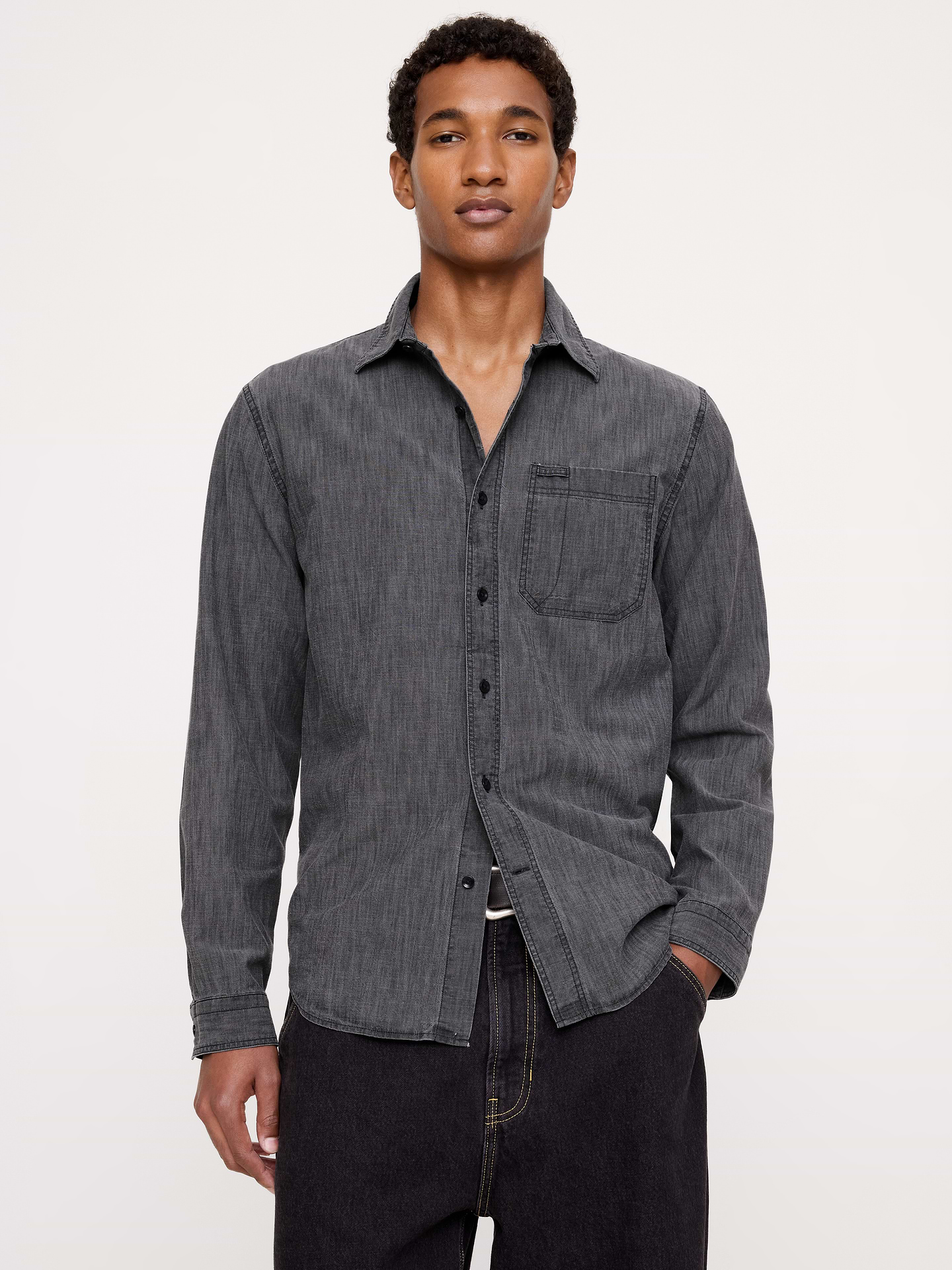 Image 1 of 7, The quintessential chambray shirt, this all-year favorite shirt is crafted in our 100% cotton chambray that is specially washed for added softness., Standard fit: A straight and easy fit., Point collar with button front., Chest pocket with glasses loop., Shirttail hem., Product #906443